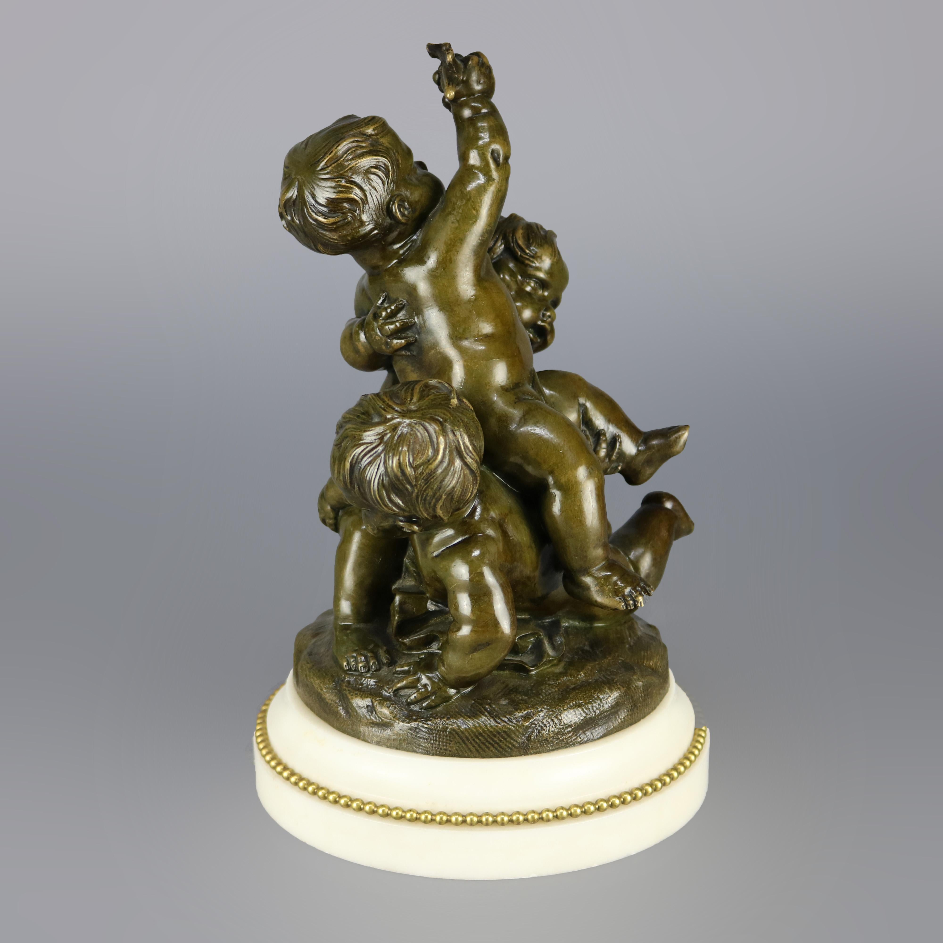 An antique French figural cast bronze sculpture grouping depicts classical Greek scene of three playful cherubs (putti) by Claude Michel Clodion (France, 1738-1814), seated on marble plinth, signed on base as photographed, 19th century

Measures: