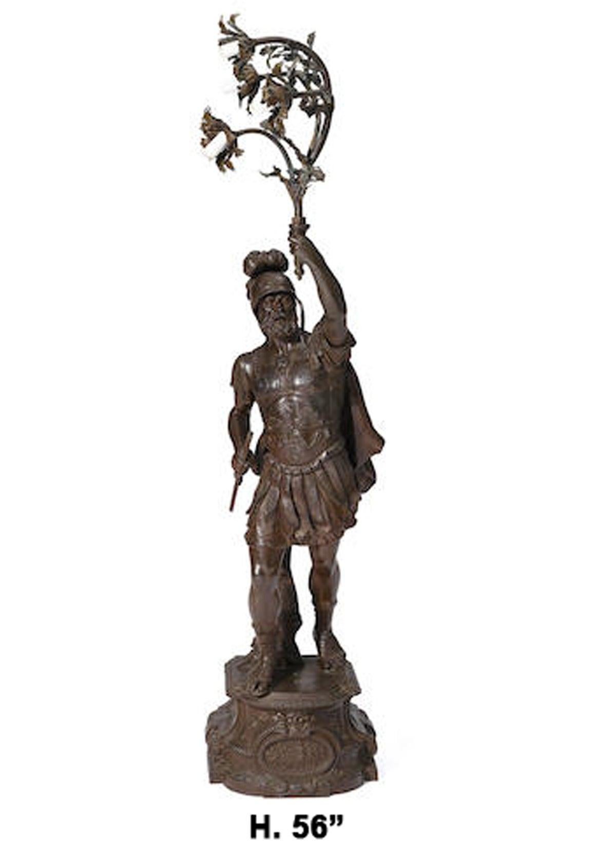 Exquisite French Roman centurion figural torchiere lamp. Signed Lion P.
19th century.

A fine bronzed patina metal sculpture depicting a centurion dressed in traditional Roman warrior gear wielding a foliate bough issuing four flower heads,