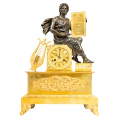 Orologio con patina di restauro e doratura a fuoco raffigurante Virgilio
