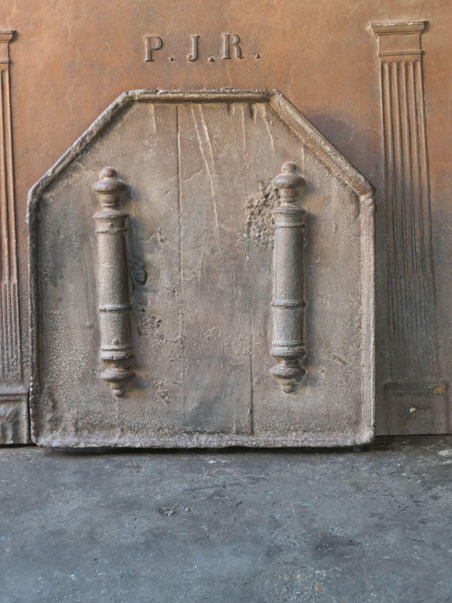 17th- 18th century French Louis XV fireback with pillars of Hercules. The pillar refers to the club of Hercules, his favorite weapon. It symbolizes power. Since antiquity, the ‘Pillars of Hercules’ are also the name of the promontories at both sides