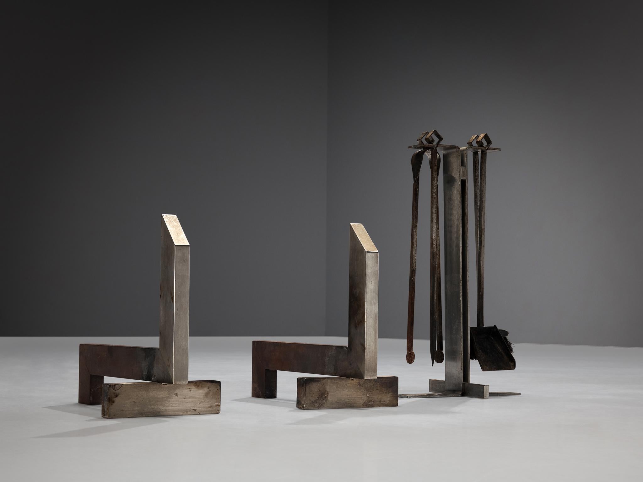 Fireplace set, metal, wood, France, 1970s

This fireplace set is based on a minimalistic construction executed in metal. The set consists of different tools. The main stand to hang the additional brush, poker, tong, and shovel. The andirons