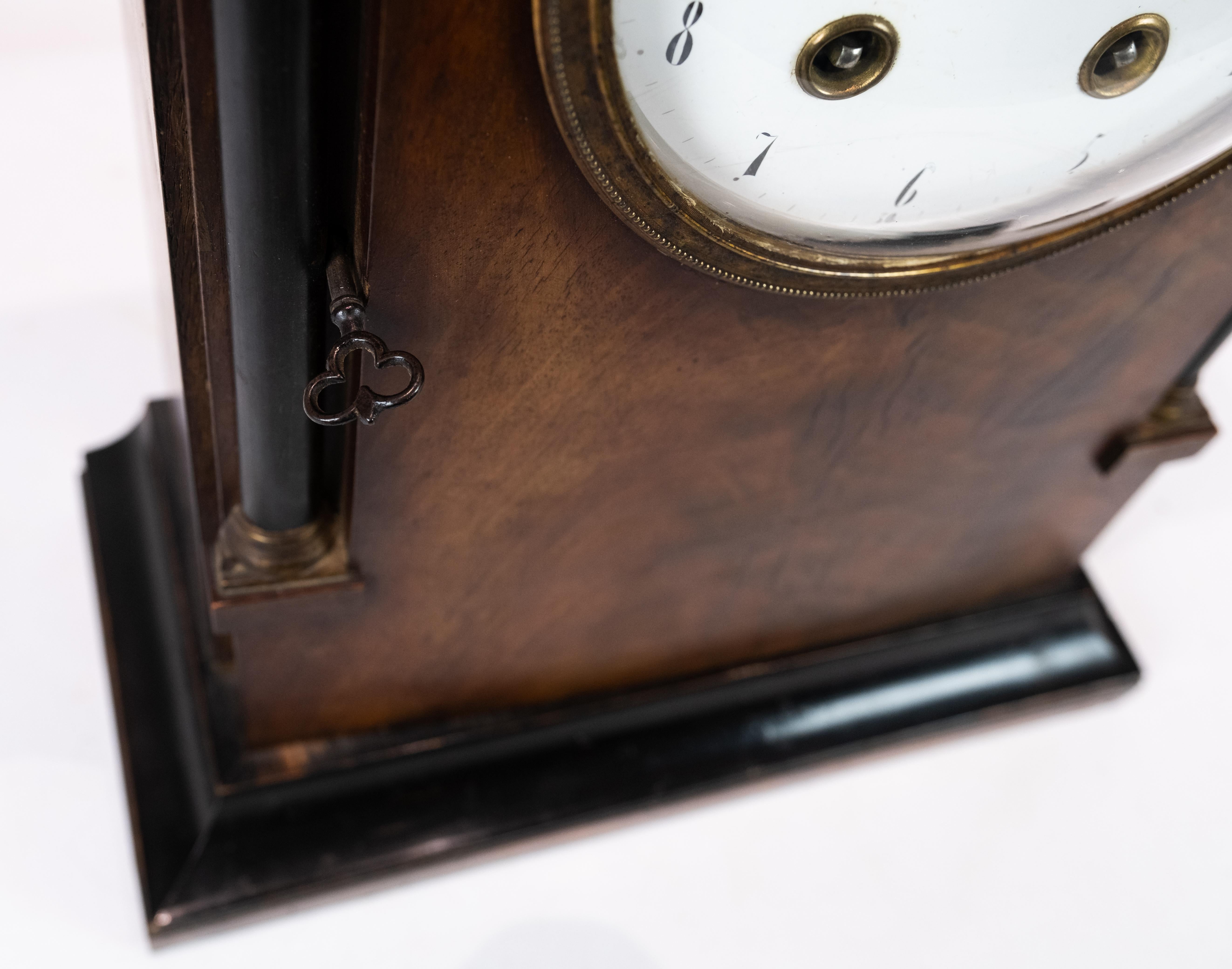 French fireplace table clock in mahogany from the 1840s. The clock is in great antique condition.
  