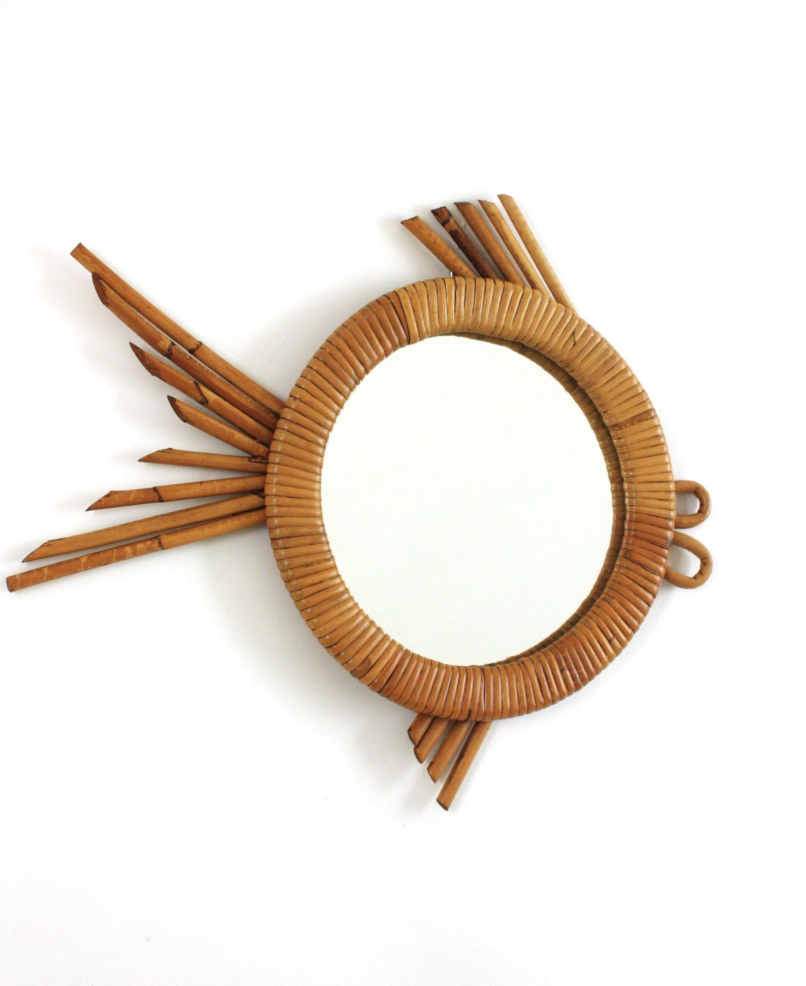 French Riviera Rattan Woven Wicker Fish Shaped Mirror, 1950s
Rare find.
Eye-catching coastal fish shaped wall mirror. Hand-crafted in rattan with hand-woven wicker wrapped round frame surrounding the central glass.
This eye-catching mirror has a