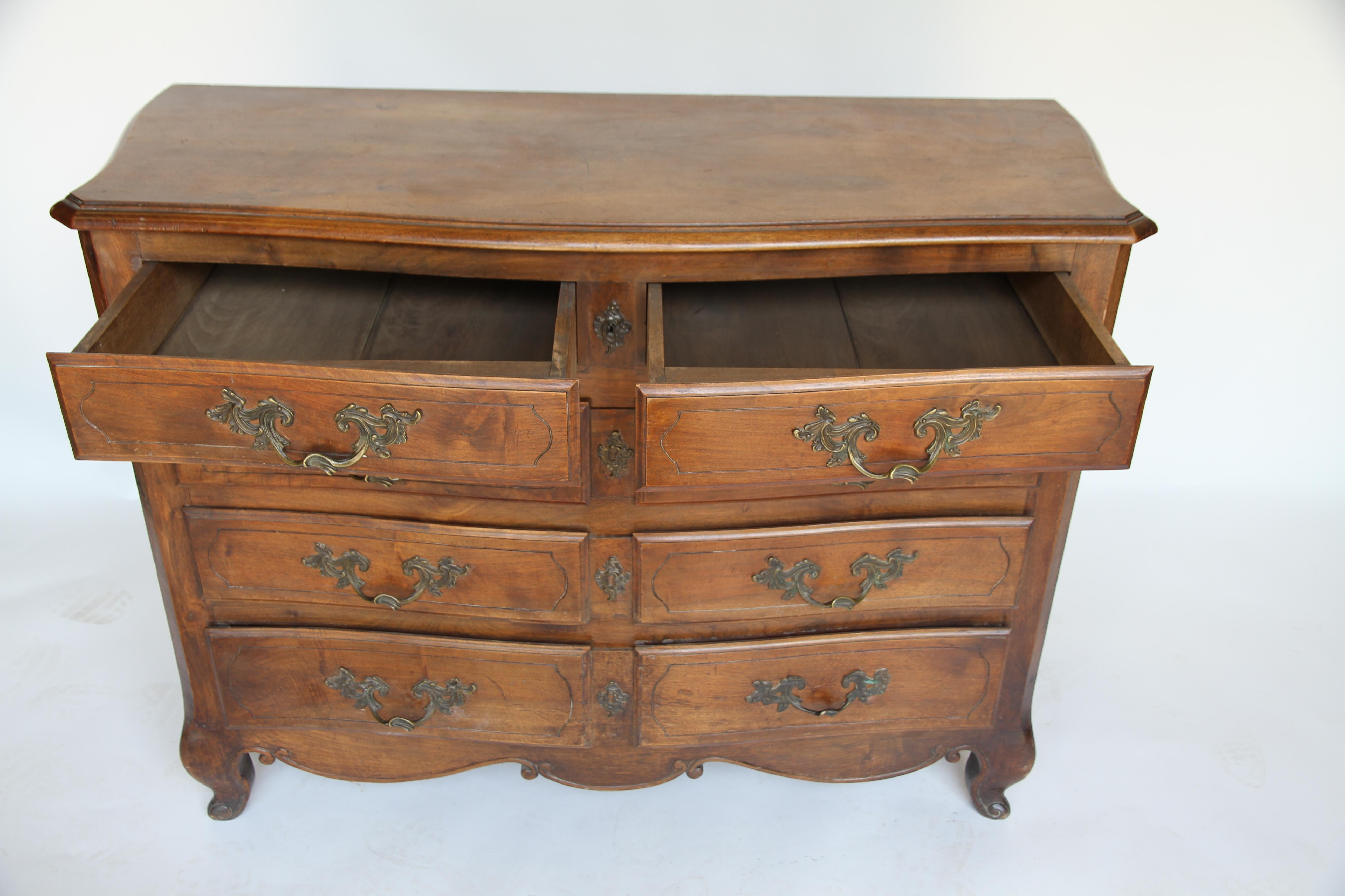 Late 19th century French Provincial five drawer oak commode. This piece has brass hardware and a beautiful patina. Wonderful storage.