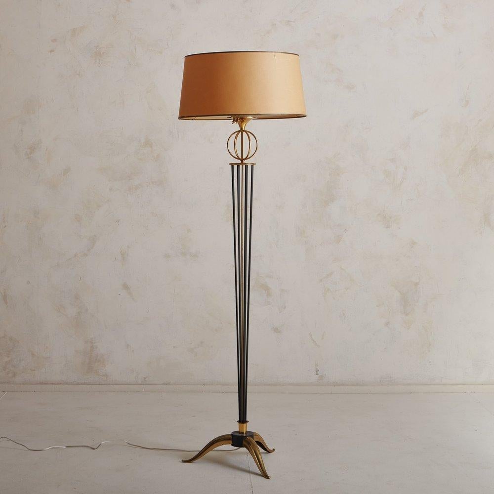 A fantastic specimen of French 1950s design by the well respected Parisian, Maison Arlus. This lamp features a black painted steel and brass base; an astrolab and the original lamps shade. The shade has a glass diffuser, which allows for a beautiful