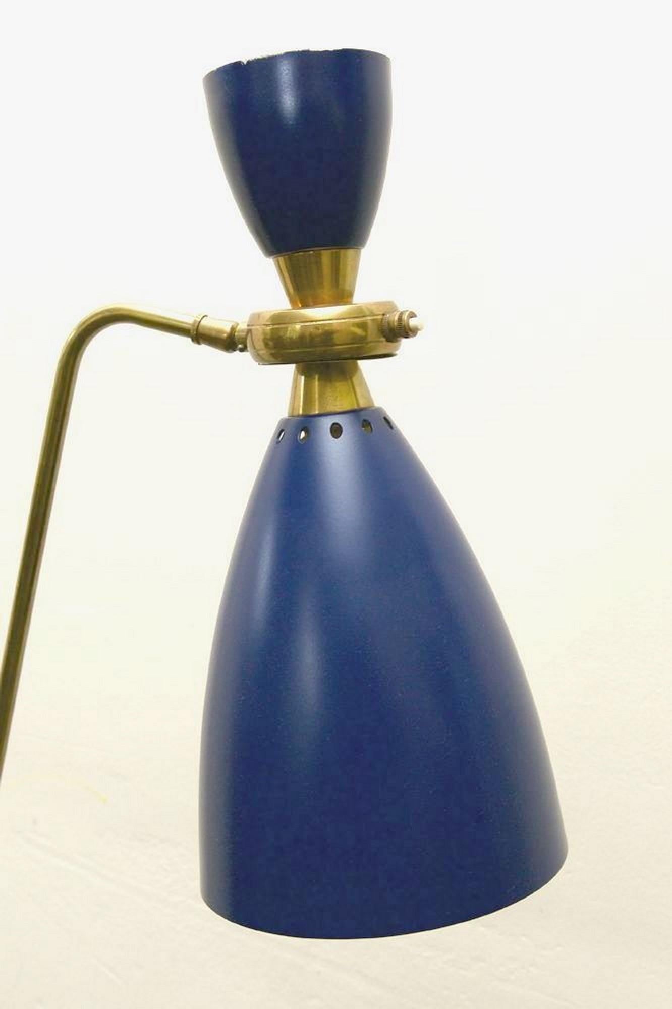 French floor lamp with simple articulated blue lacquered aluminium shade, and brass and black lacquered metal stem which is height regulatable.