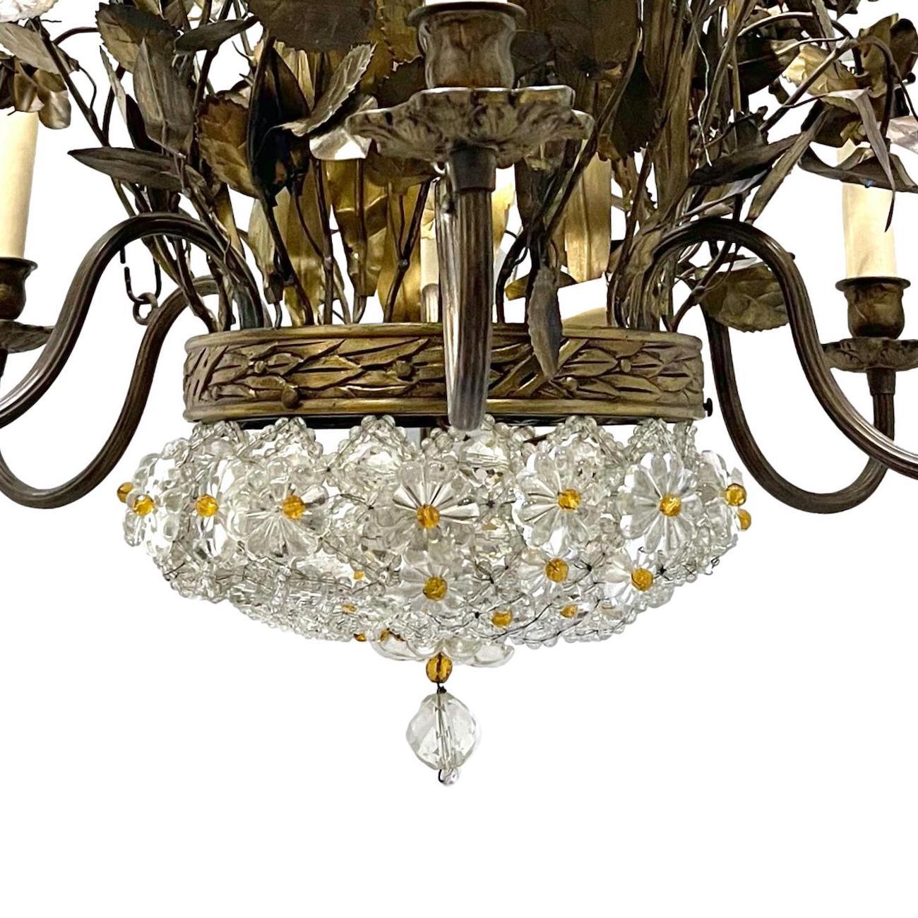A circa 1940's French patinated bronze six-arm floral motif chandelier with molded glass and amber crystal body that has an interior light.

Measurements:
Drop: 34