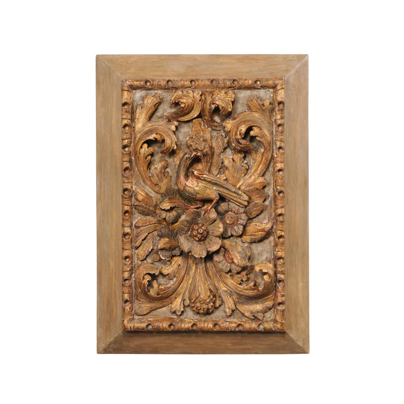 A French carved wood wall plaque, in flowers and bird motif, from the 19th century. This antique wall decoration from France features a rectangular-shaped molded frame, with inner surround comprised of a repeating scrolling acanthus leaf trim, about