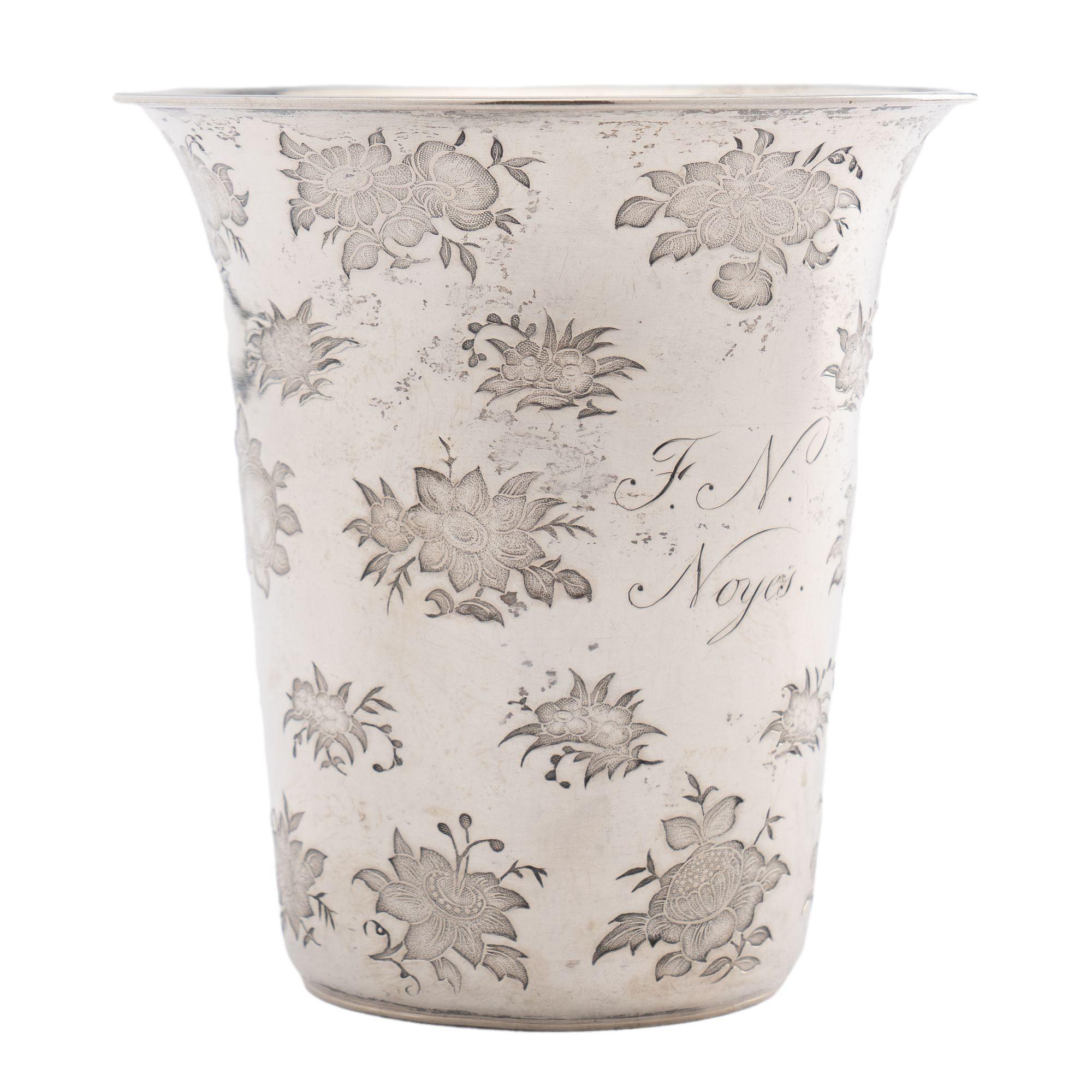 Floral die stamped silver spill vase with flared rim. Engraved on the side with the name 