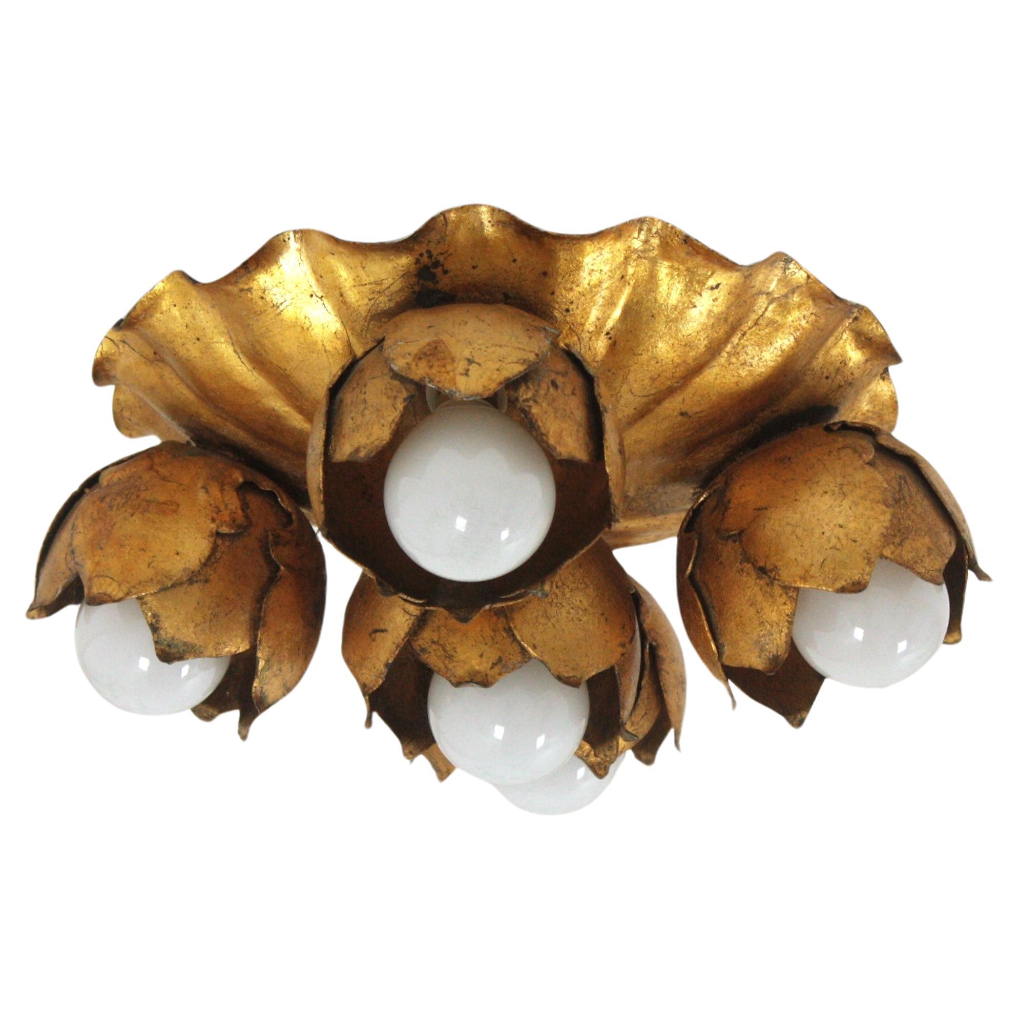 Flower bouquet ceiling light fixture / wall ligh in gilt iron

French 1940s gilt metal five light Floral Bouquet wall or ceiling light fixture. 
A beautiful Hollywood Regency gilt wrought iron floral flush mount or wall sconce. This lovely light