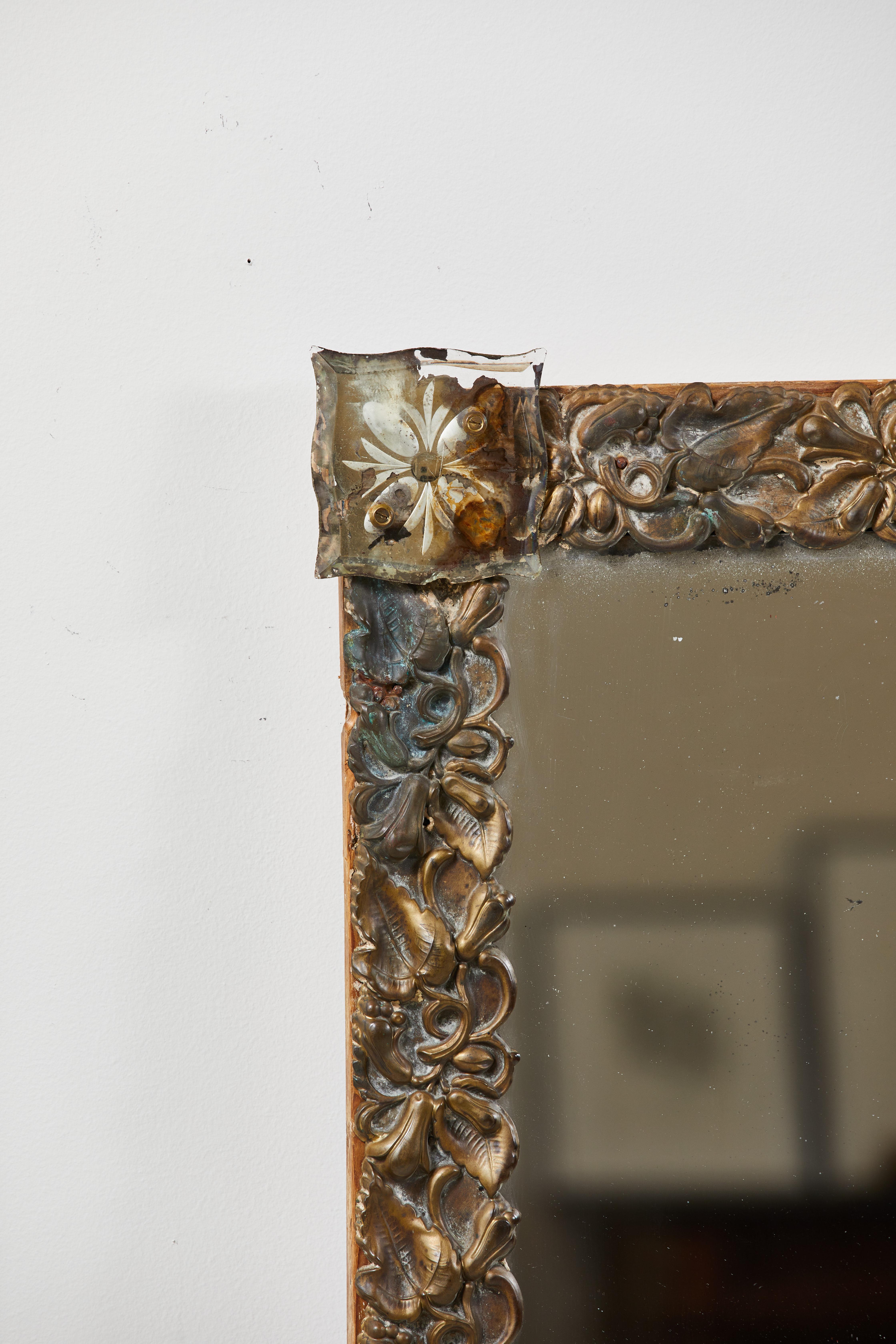 French mirror with brass floral frame, each corner of the mirror has an intricate glass floret.