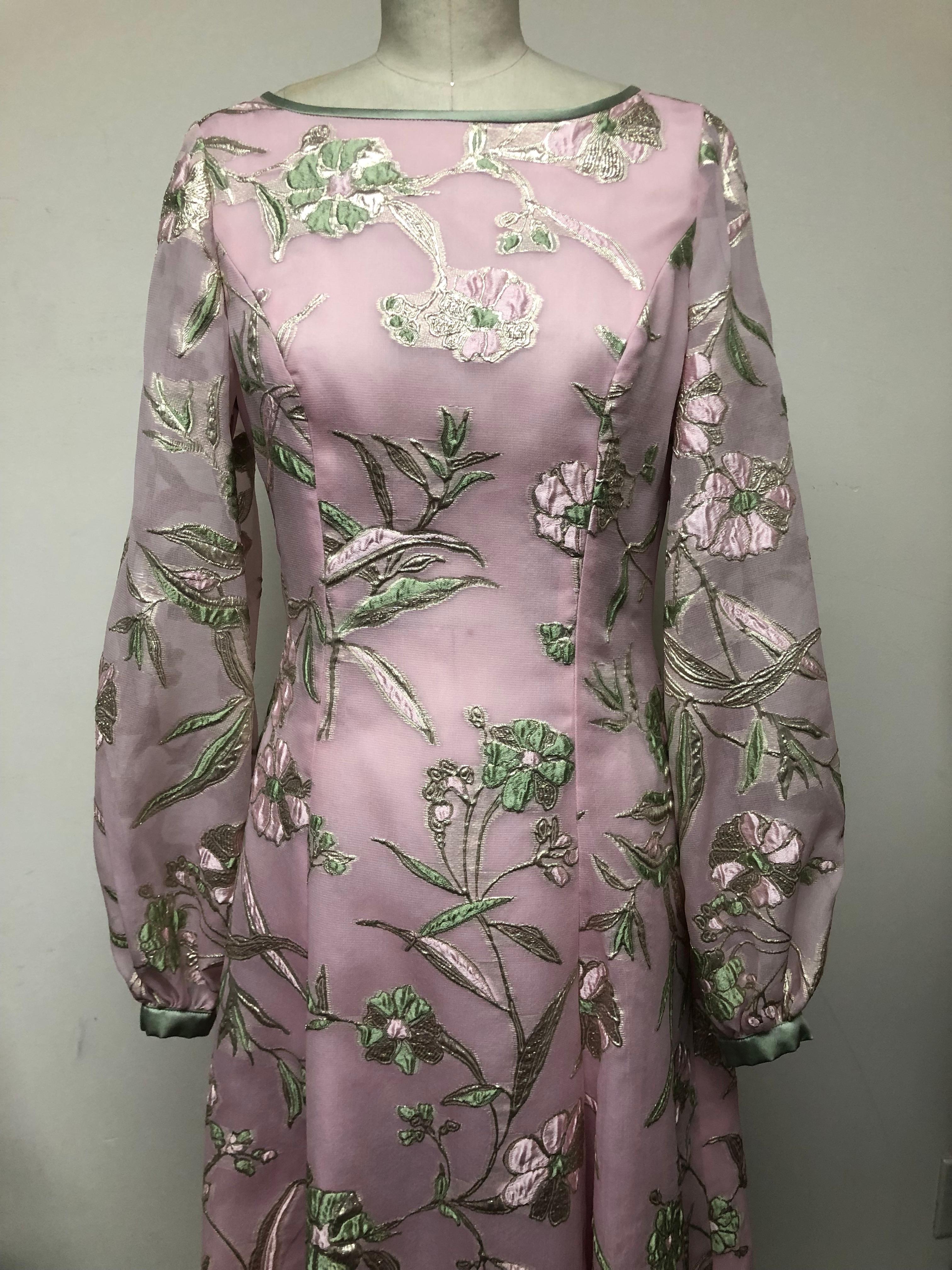 Timeless feel! Pink green and gold floral organza princess seamed gown, perfect for winter getaways to Palm Beach and Bahamas, and spring and summer garden parties. Allover machine floral embroidery adds a lovely texture to this loosely fitted,