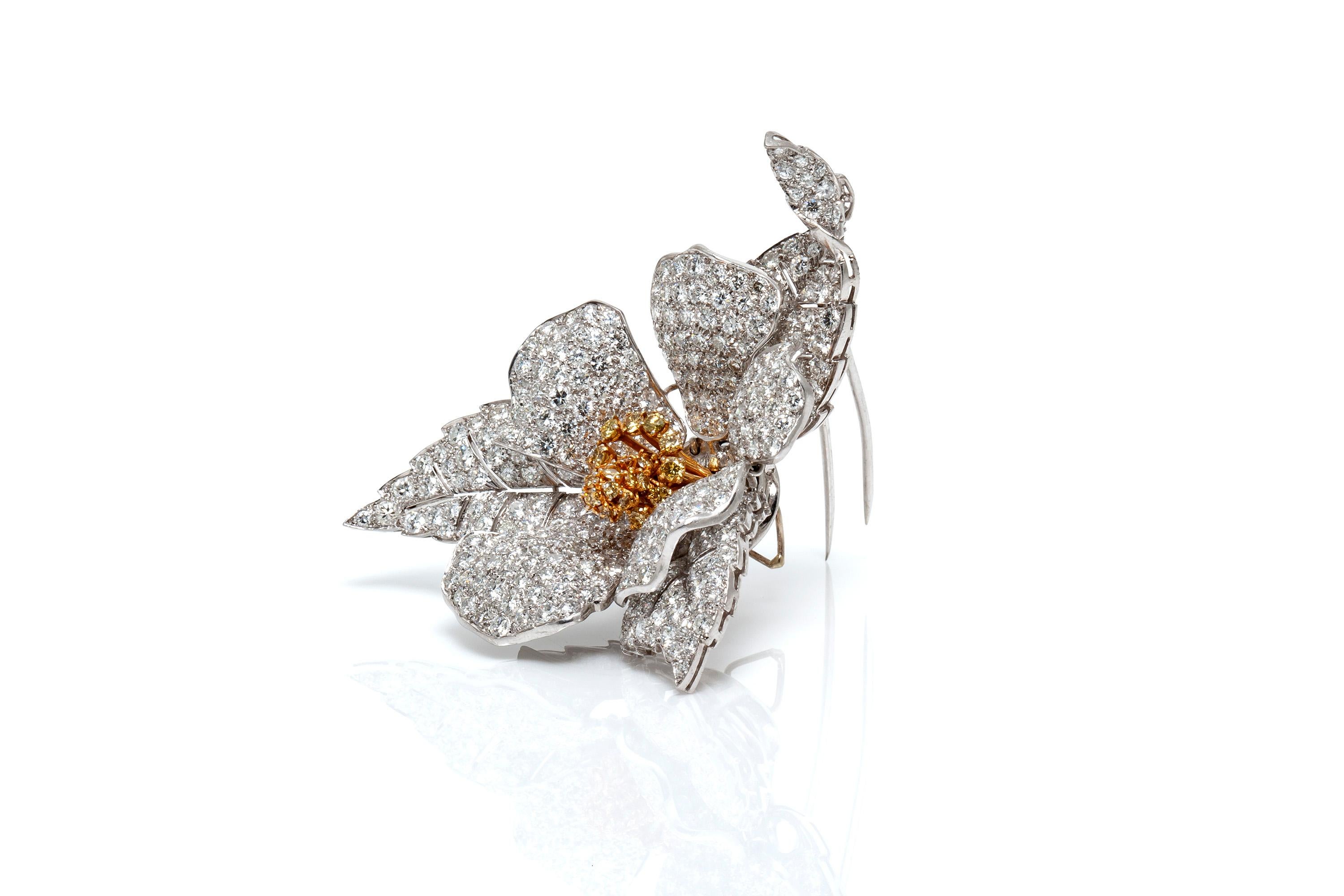 French flower brooch, finely crafted in platinum with diamonds weighing approximately a total of 26.00 carats.
