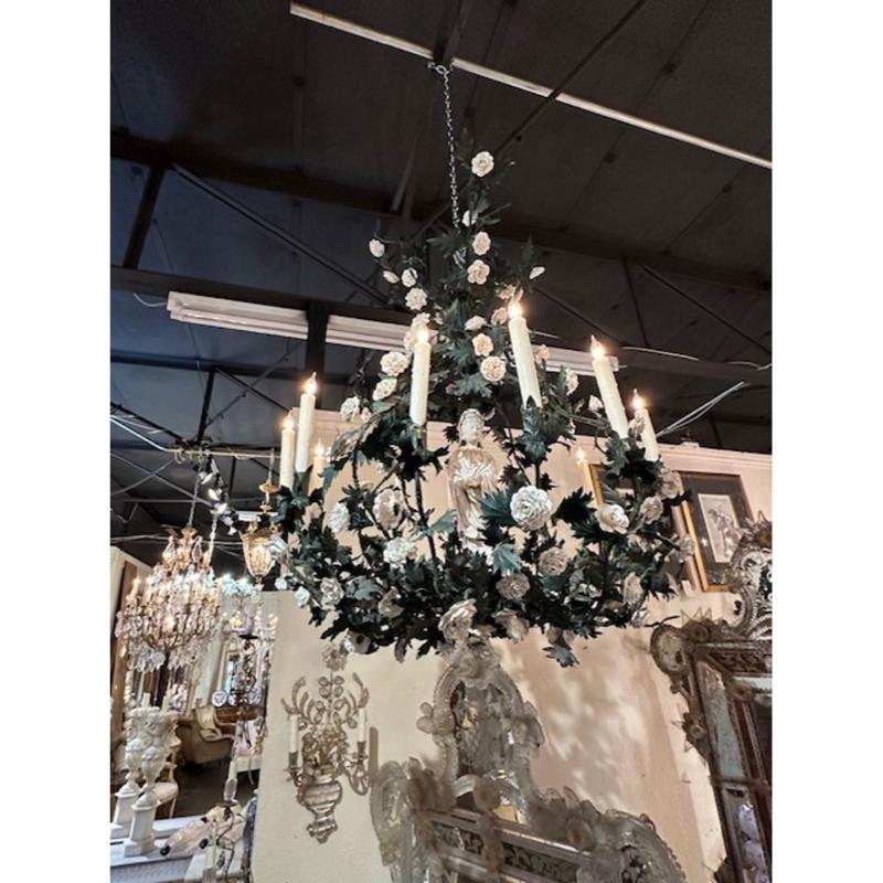 Rare 19th century French Parisian painted toe and porcelain flower chandelier with central Chinese porcelain figure. Circa 1880.
The chandelier has been professionally rewired, comes with matching chain and canopy. It is ready to hang!