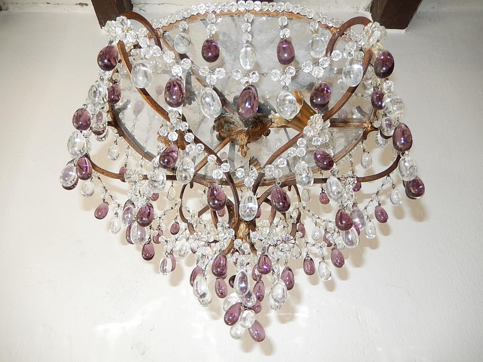 Rewired and ready to hang. Housing three lights under shiny silver to reflect even more light. Beading on top. Swags of vintage rock crystals with Murano drops in clear and amethyst throughout. Florets and a beautiful finial. Free priority shipping
