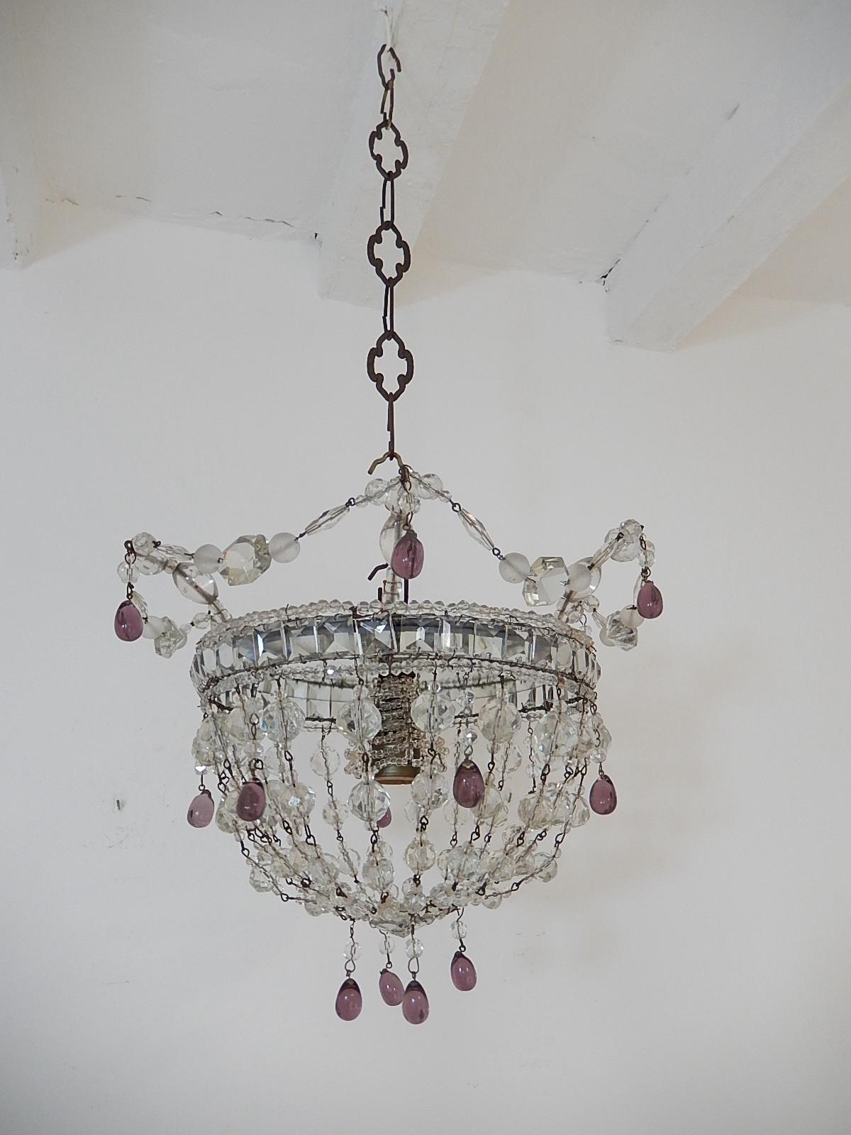 Housing 1 light, sitting under a vintage beaded bulb holder. Will be rewired with appropriate socket for country and ready to hang. This looks like a crown on top with the swags of vintage crystals springing from top. Basket bottom with huge crystal