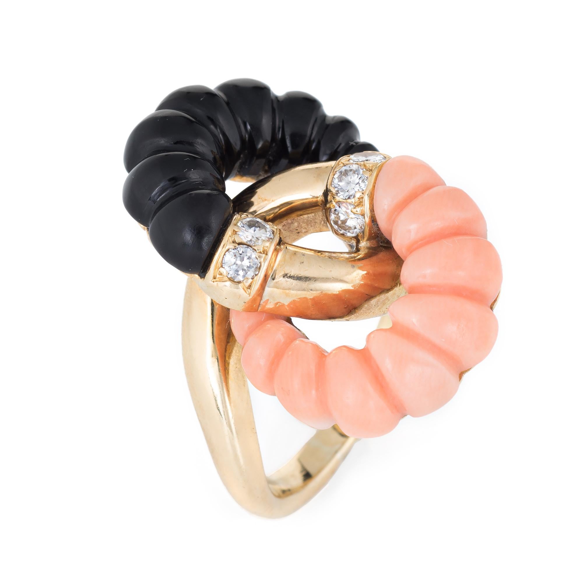 Stylish vintage fluted coral & onyx cocktail ring (circa 1950s to 1960s), crafted in 18 karat yellow gold. 

Fluted coral & onyx measures 7mm wide. Six estimated 0.03 carat round brilliant cut diamonds total an estimated 0.18 carats (estimated at