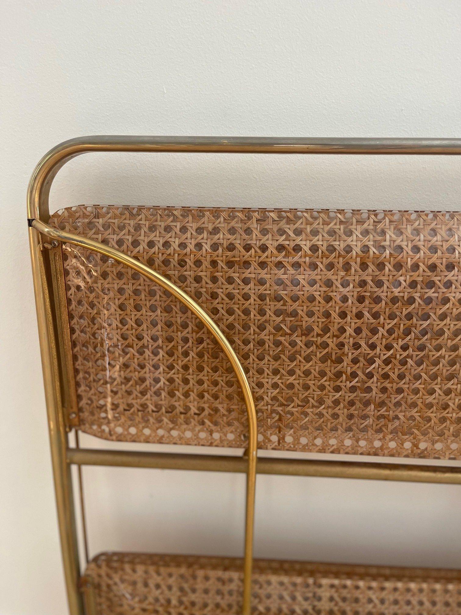  Lovely tea or bar cart which is foldable, perfect for easy storage for smaller spaces. Wicker encased in lucite with brass, this cart is on wheels ready for your next soiree! 