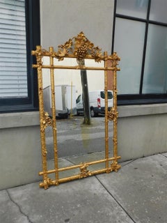 French Foliage Grapevine Gilt wood and Gesso Flanking Dove Wall Mirror, C. 1810