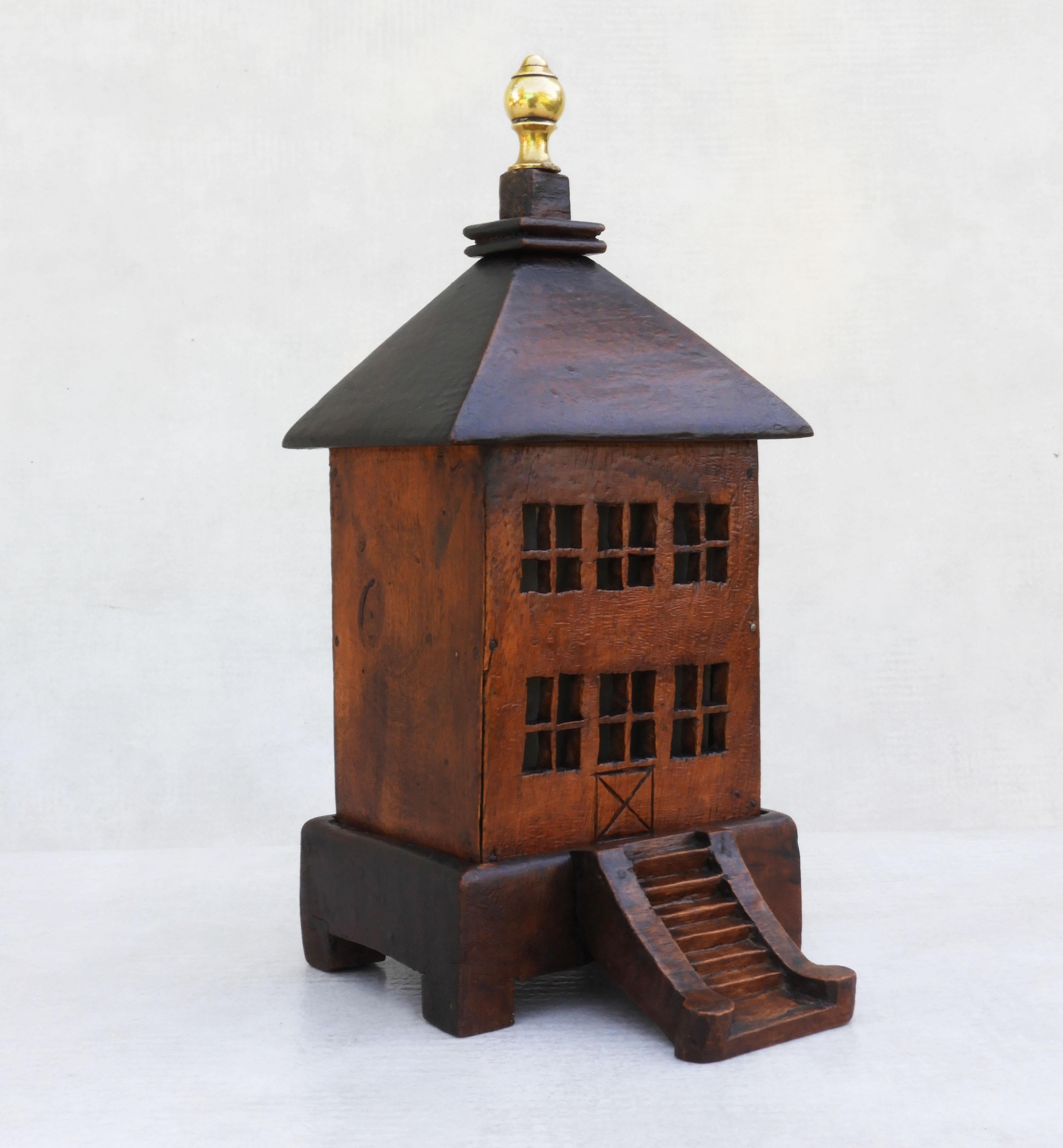 Folk Art money box c1900 France
A fabulous example of French 'Arte Populaire' this 'Maison Tirelire' is handcrafted in wood complete with a carved staircase entrance, glass windows and brass roof finial.  All in very good original condition with