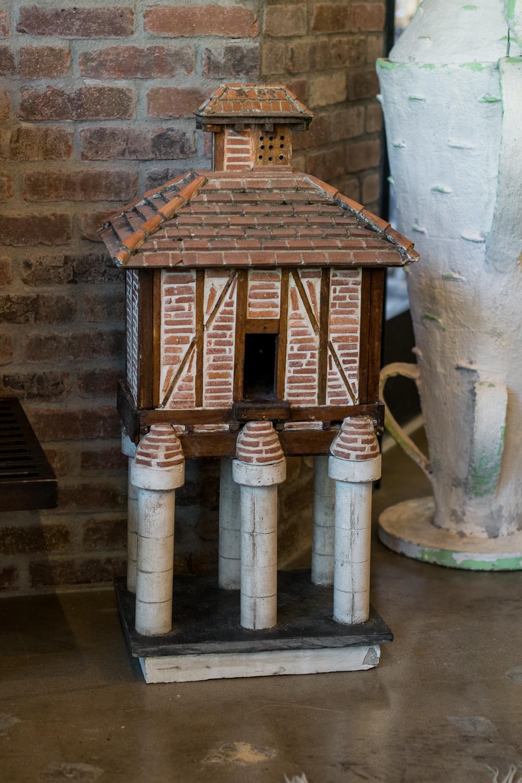 Charming handmade birdhouse fashioned from remnant terracotta tile, wood and mortar into a well-constructed architectural element. Includes clay tile roof and masonry columns with slate and masonry base. Captivating as an interior sculptural