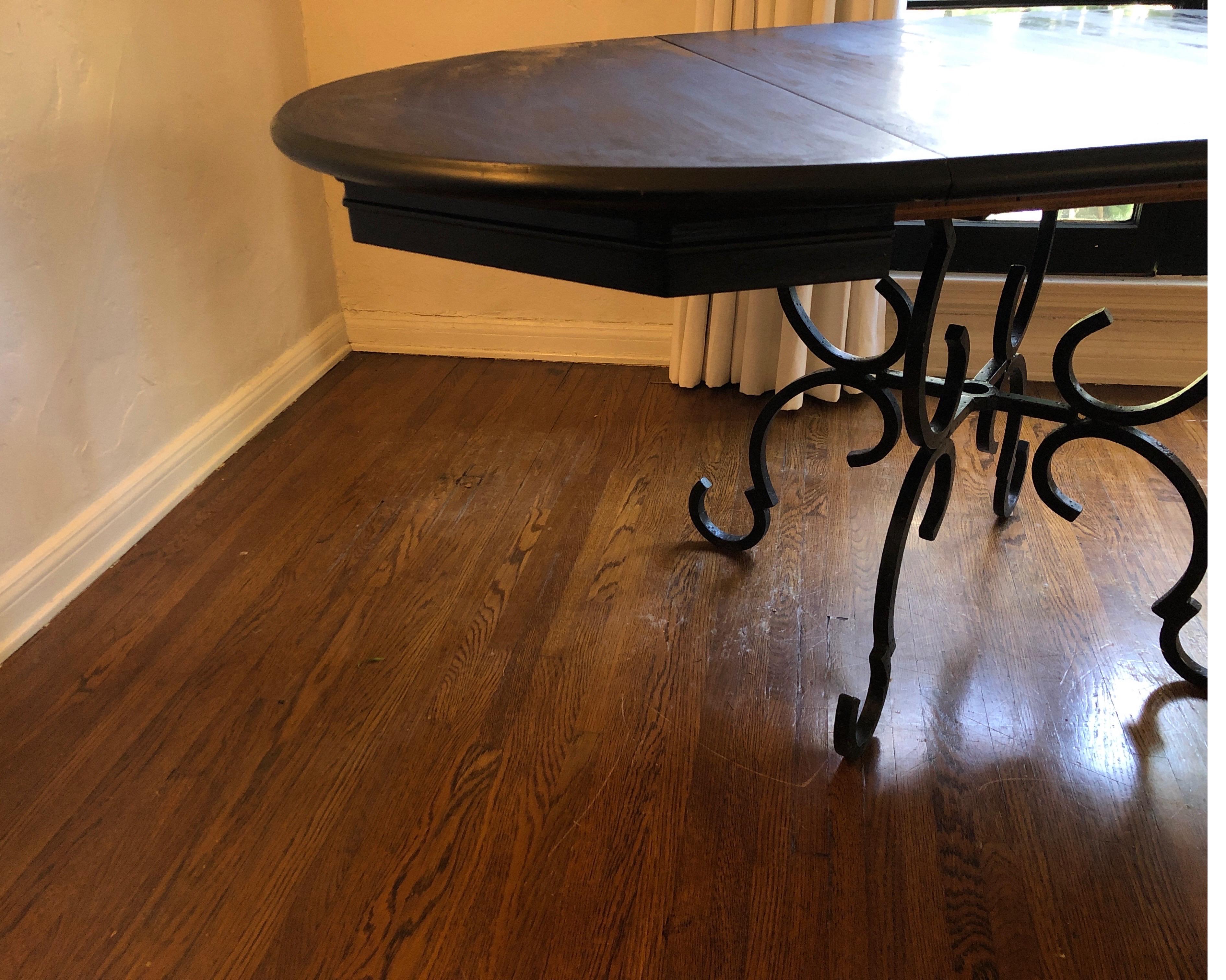 Hand forged iron base table with lacquered black extension table.
Base made in France, top made in USA. 

Has three different extensions at the following dimensions:
6 ft 4 x 40
5 ft 4 x 40
4 ft 4 x 40
3 ft 4 circle (40 inches).