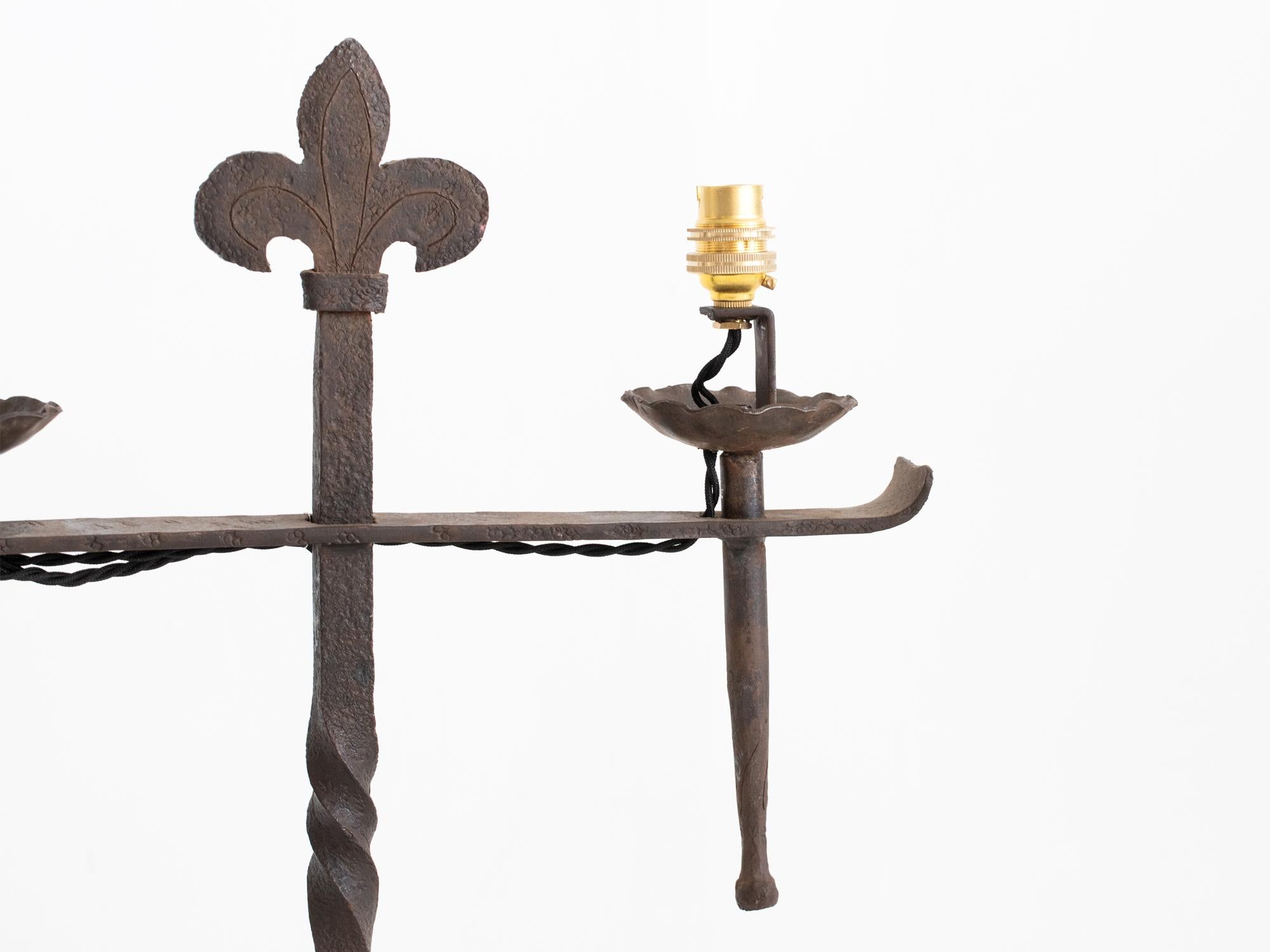 A pair of forged iron candlesticks converted to electricity. French, c. 1870.

Professionally re-wired.

Sold as a pair.

48.5 x 42 x 21 cm

19.1 x 16.5 x 8.3 
