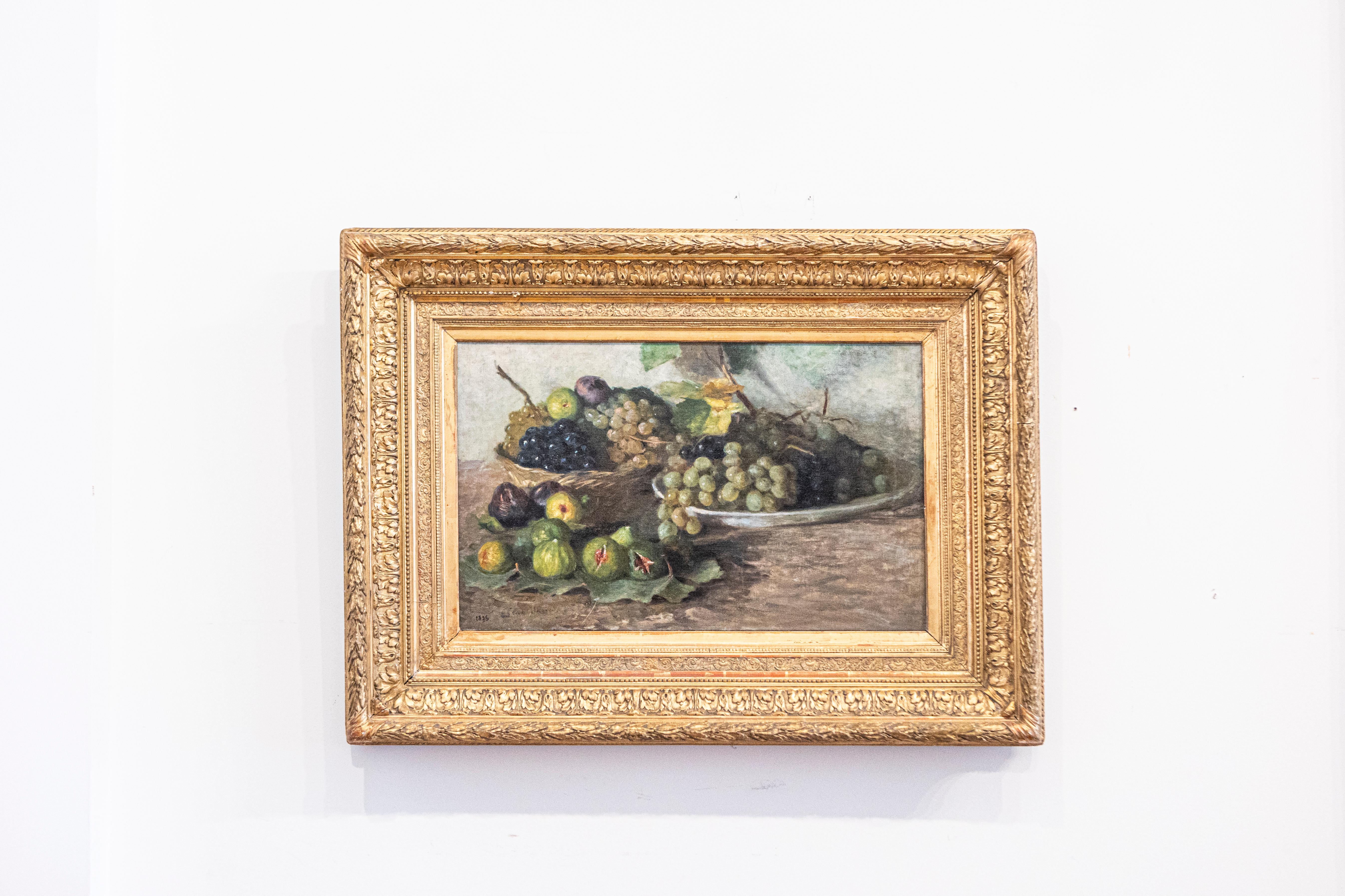 A French framed oil on canvas still-life painting from the late 19th century depicting fruits. Created in France circa 1875, this oil on canvas painting depicts a humble arrangement of mouth-watering grapes and figs, displayed in a plate, a wicker