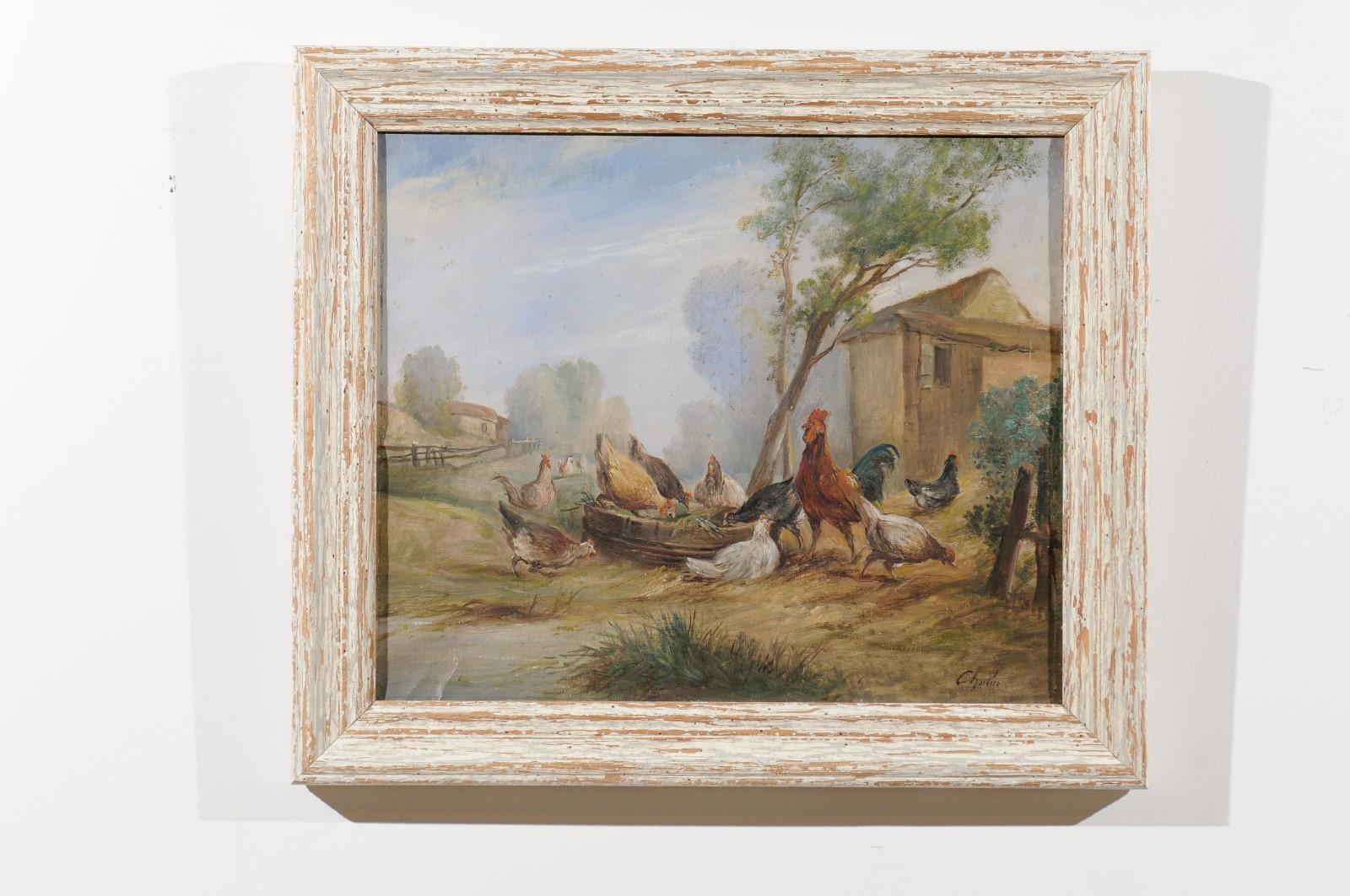 A French framed oil on canvas painting from the 20th century depicting a farmyard scene with hens and rooster. Created in France during the 20th century, this oil on canvas painting depicts a humble farmyard scene. Hens freely roaming and peckering