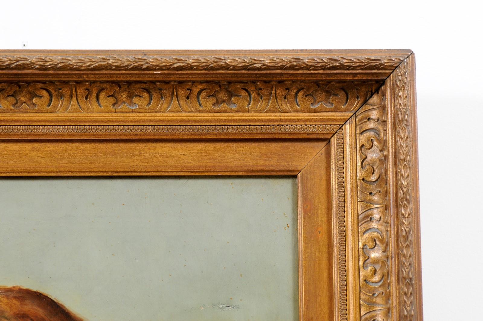 A French framed oil on canvas painting from the early 20th century signed E. Kirk, depicting a St Bernard dog. Created in France during the first quarter of the 20th century, this oil on canvas painting features a three-quarter profile of a St