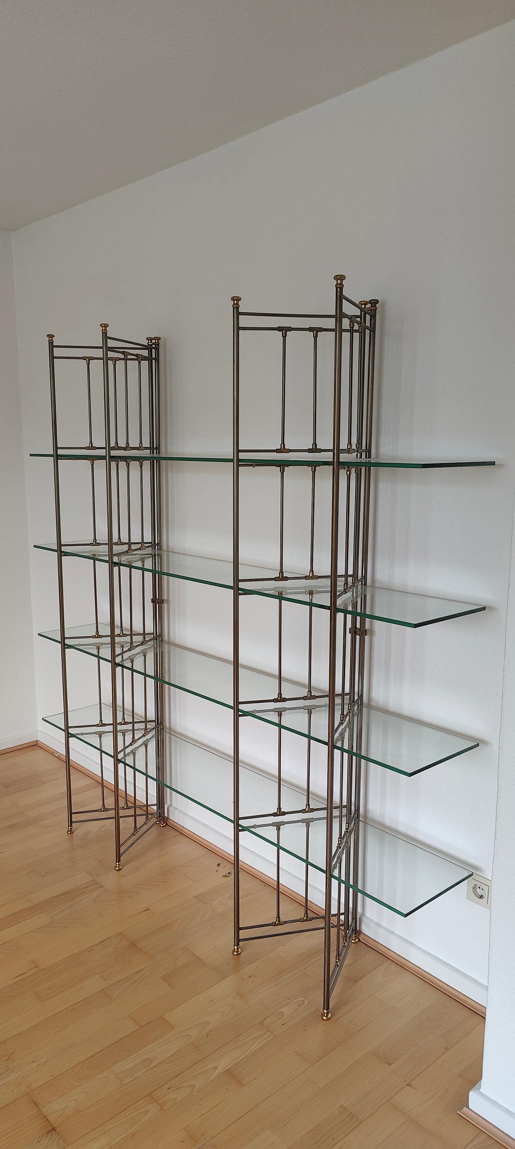 beautiful freestanding bicolour shelf with glass plates .
The shelf has some nice details and material mix. The glass plates are not fixed at the ledders but the shelf stands very well. Wonderful place for small items .
This shelf is an eye-catcher