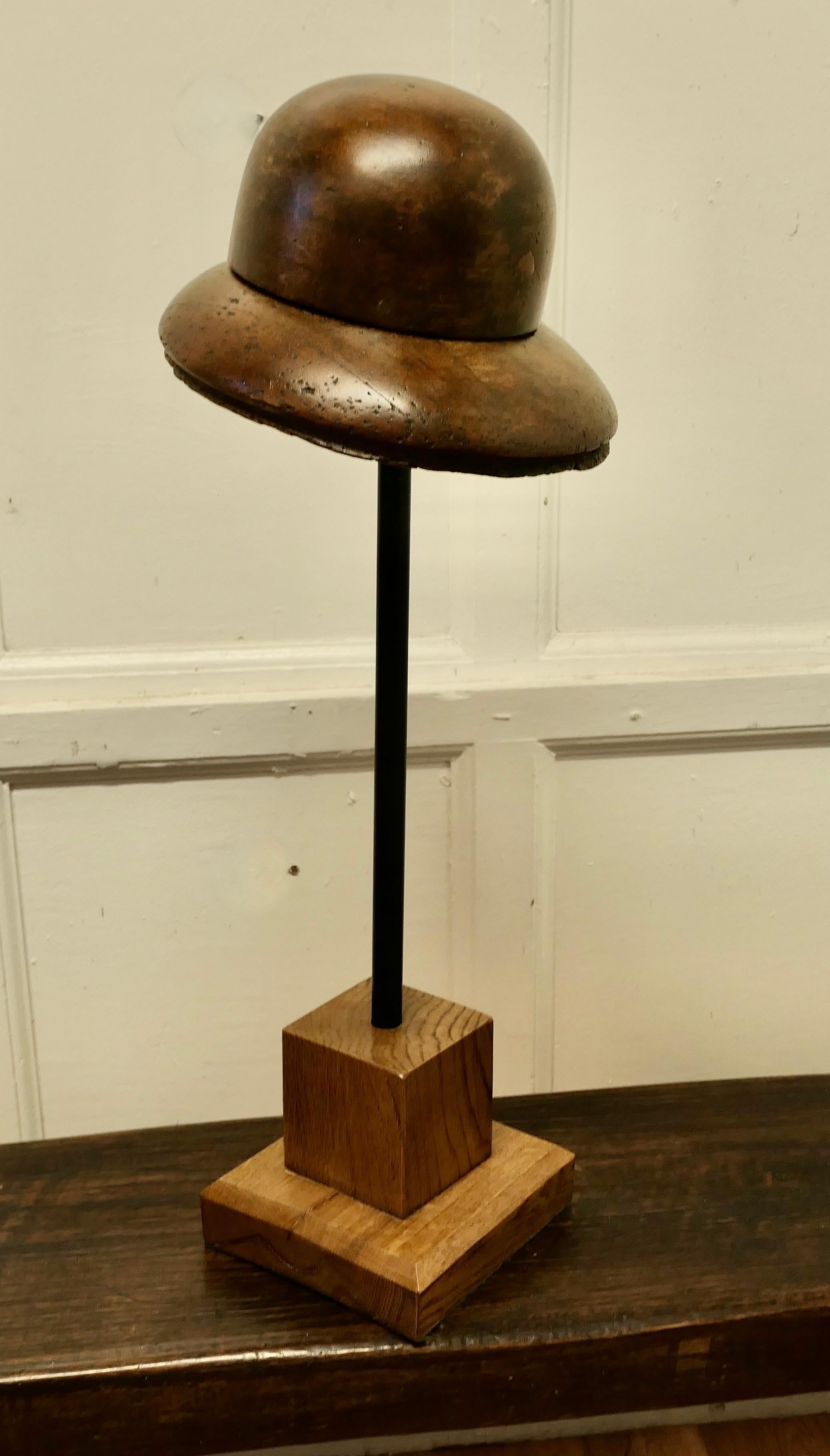 French fruit wood hat block Milliners form

This is a form for a 1920s Deep Brim Cloche style hat, with a deep round crown, it is a superbly tactile and very attractive piece. The hat form is made in fruitwood, and it is on a purpose made Ash