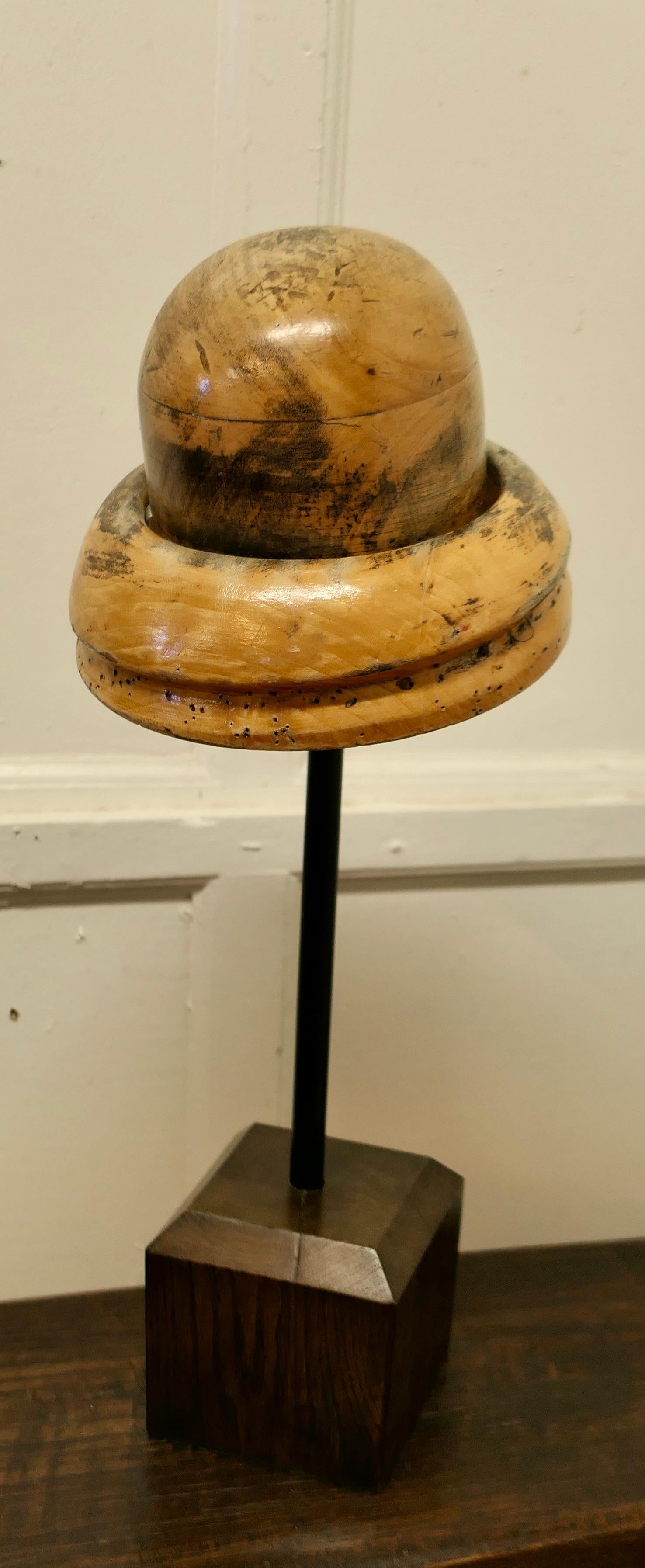 French Fruit Wood Hat Block Milliners Form

This is a form for a 1920s Double Brim Cloche style hat, with a deep round crown and a double brim, it is a superbly tactile and very attractive piece. The hat form is made in fruitwood, and it is on a