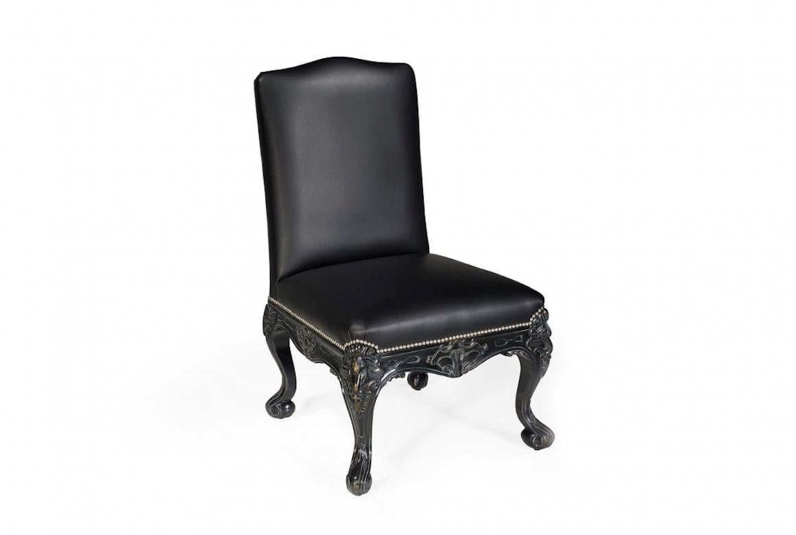 A stunning French Galliano Louis XV desk/dining chair, 20th century.

The Galliano desk chair is shown in oakwood with an antique black finish. It features a tight seat traditionally upholstered with hand-tied springs and heavily hand carved Louis