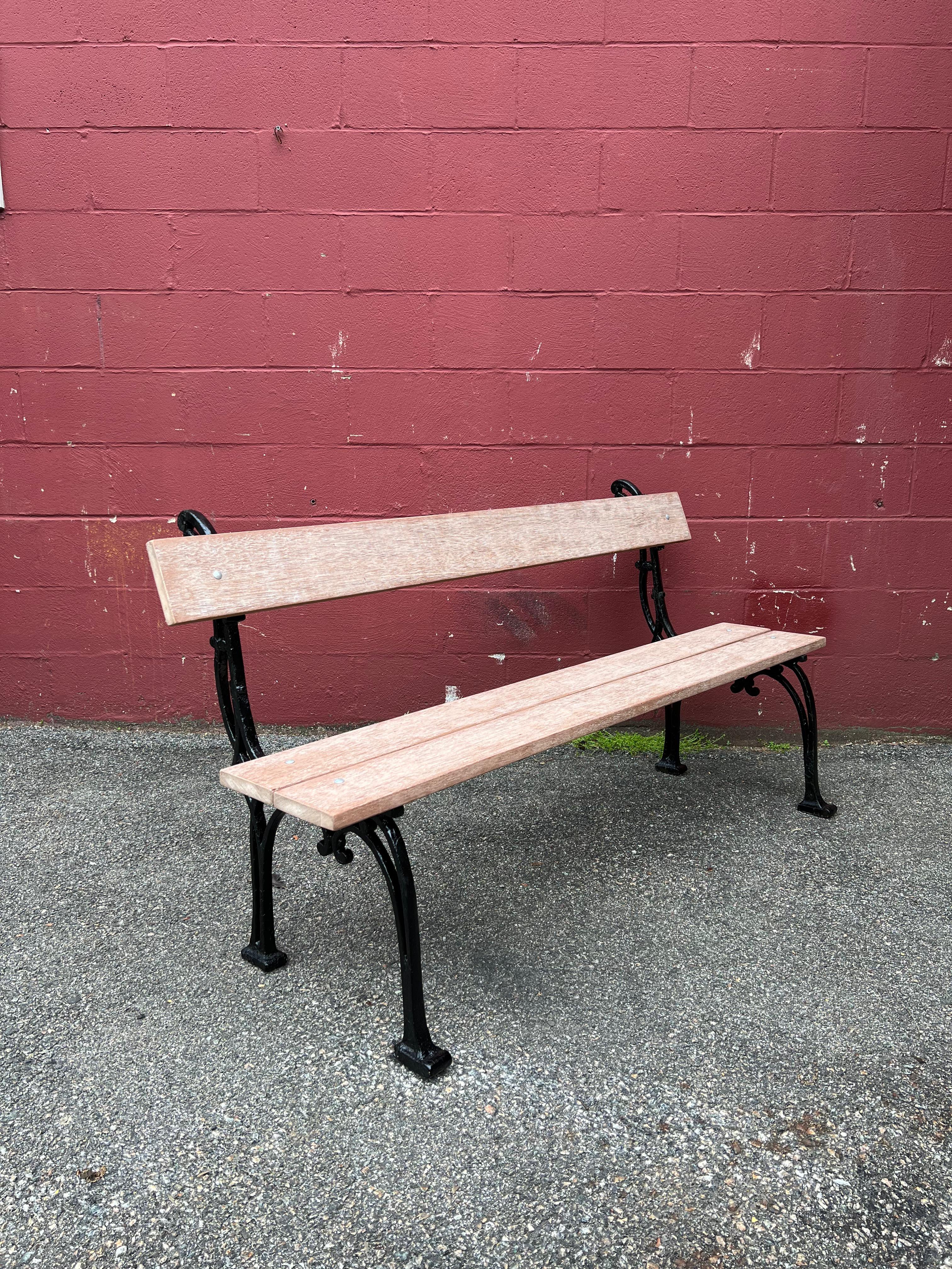 This beautiful French garden bench will add a touch of elegance to any garden or patio. The solid mahogany seat and back planks are not only beautiful, but also durable and weather-resistant. The light limed patina applied to the wood adds a