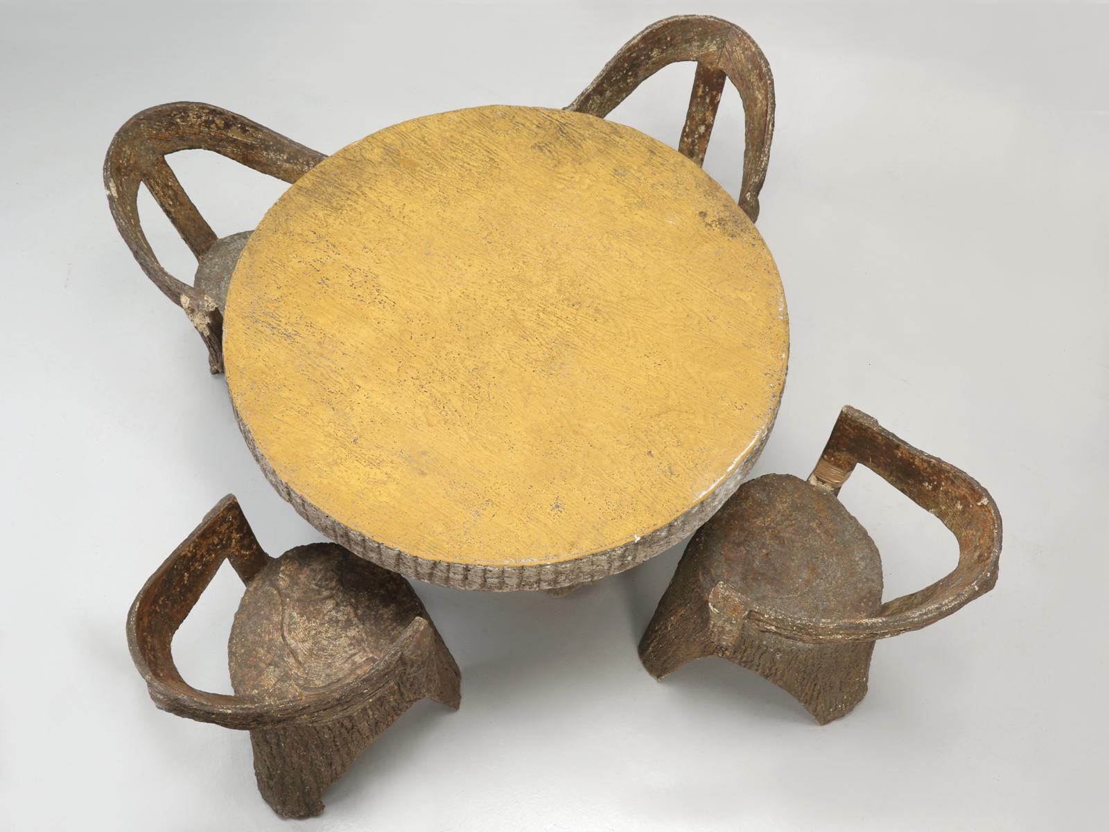 Although made from concrete, these wraparound garden chairs are actually quite comfortable and are still in their original condition. The faux bois (French for false wood) is an artistic imitation of wood graining in different media. The French