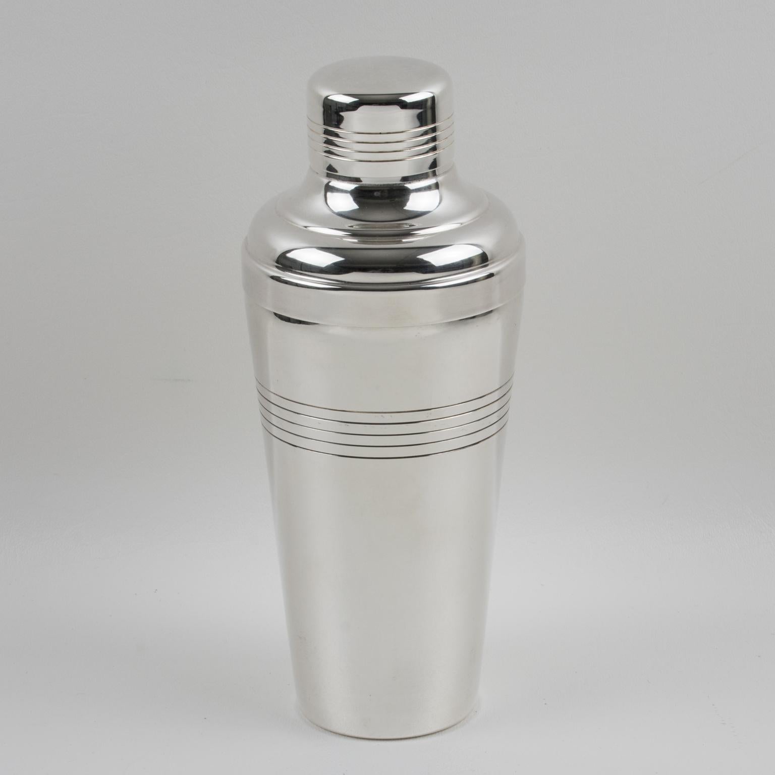 Elegant French Art Deco silver plate cylindrical cocktail or Martini shaker by silversmith Gelb, Paris. Three sectioned designed cocktail shaker with removable cap and strainer. Lovely geometric shape with typical Deco design. Marked underside with