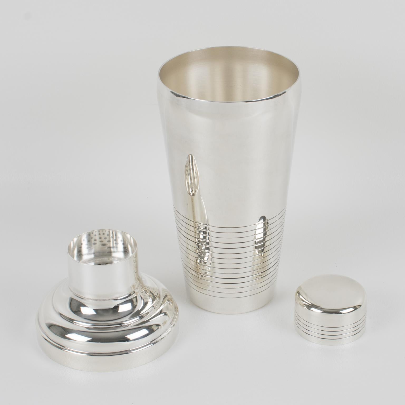 Elegant French Art Deco silver plate cylindrical cocktail or Martini shaker by silversmith Gelb, Paris. Three-sectioned designed cocktail shaker with removable cap and strainer. Lovely geometric shape with typical Deco design. Marked underside with