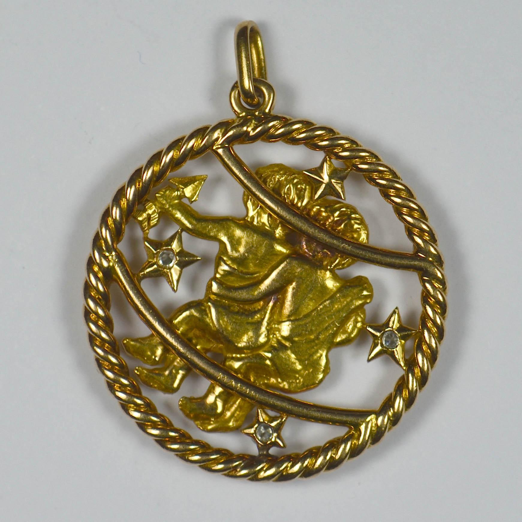 A large French yellow gold Gemini pendant charm designed as two children surrounded by diamond set stars, one holding a harp and an arrow, the other bearing a club; the classic symbols of the Zodiac twin kings who would bring about peace, justice