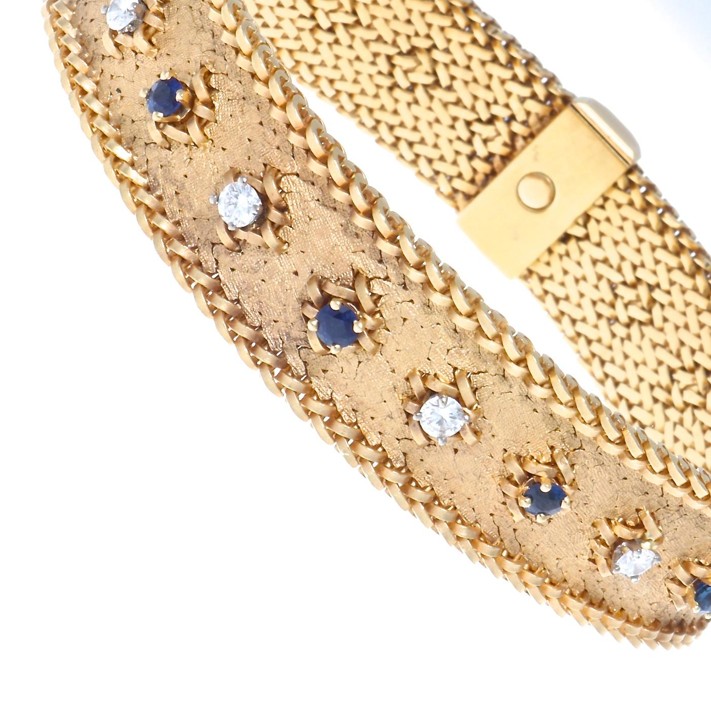French George L'enfant diamond, sapphire and 18k yellow gold bracelet. Featuring 10 round brilliant cut diamonds that weigh approximately 1 carat, graded E-F color, VVS clarity. With 11 sapphires that weigh approximately 1.25 carats. 45.2 grams.