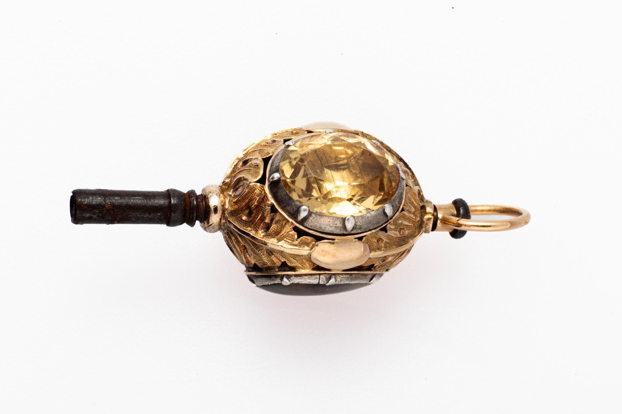 A French Watch Key c. 1810 is 18kt gold on silver set with an oval amethyst, citrine and dendritic agate. It would be unique paired with my large French Carnelian Watch Key. The stones are silver over gold set in the Georgian manner. Engraved is a