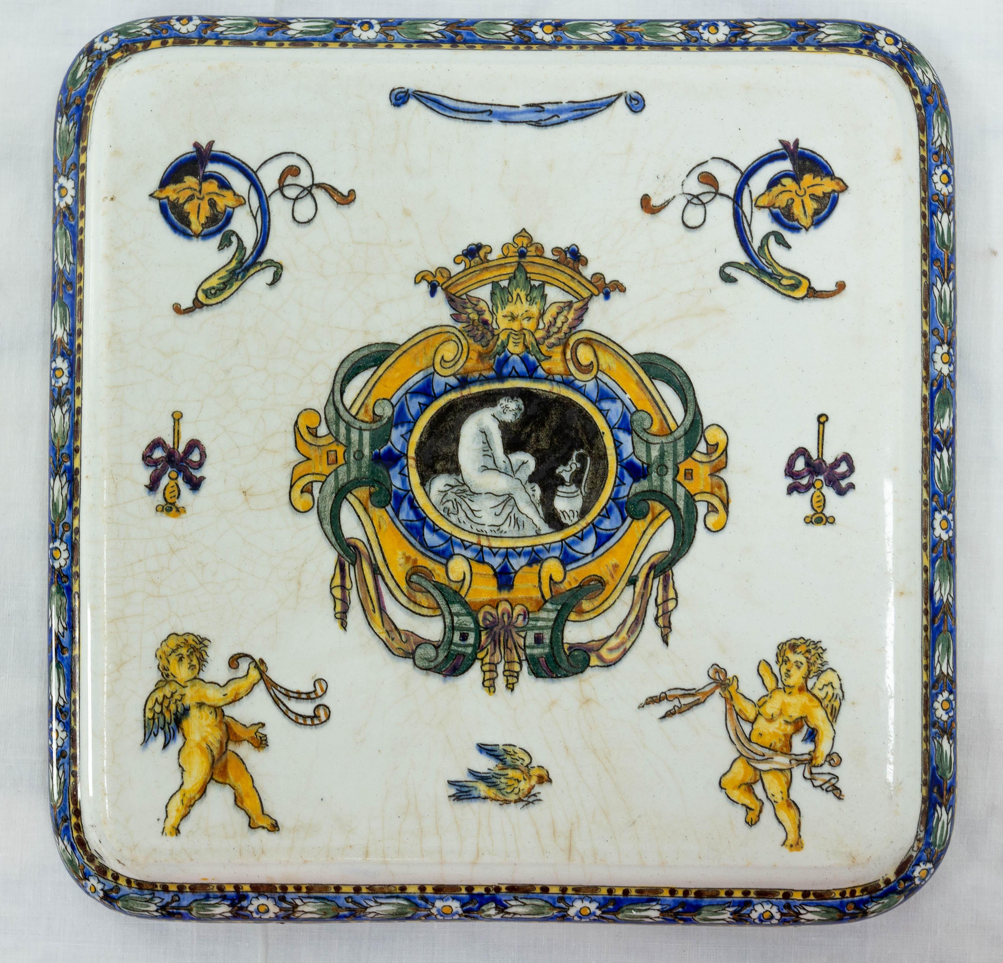 French Faience de Gien trivet or coaster.
Vegetal decor with two angel and a bird, in the Italian renaissance style.
The earthenware factory of Gien or the earthenware factory of Gien is a fine earthenware manufacturing company located in the