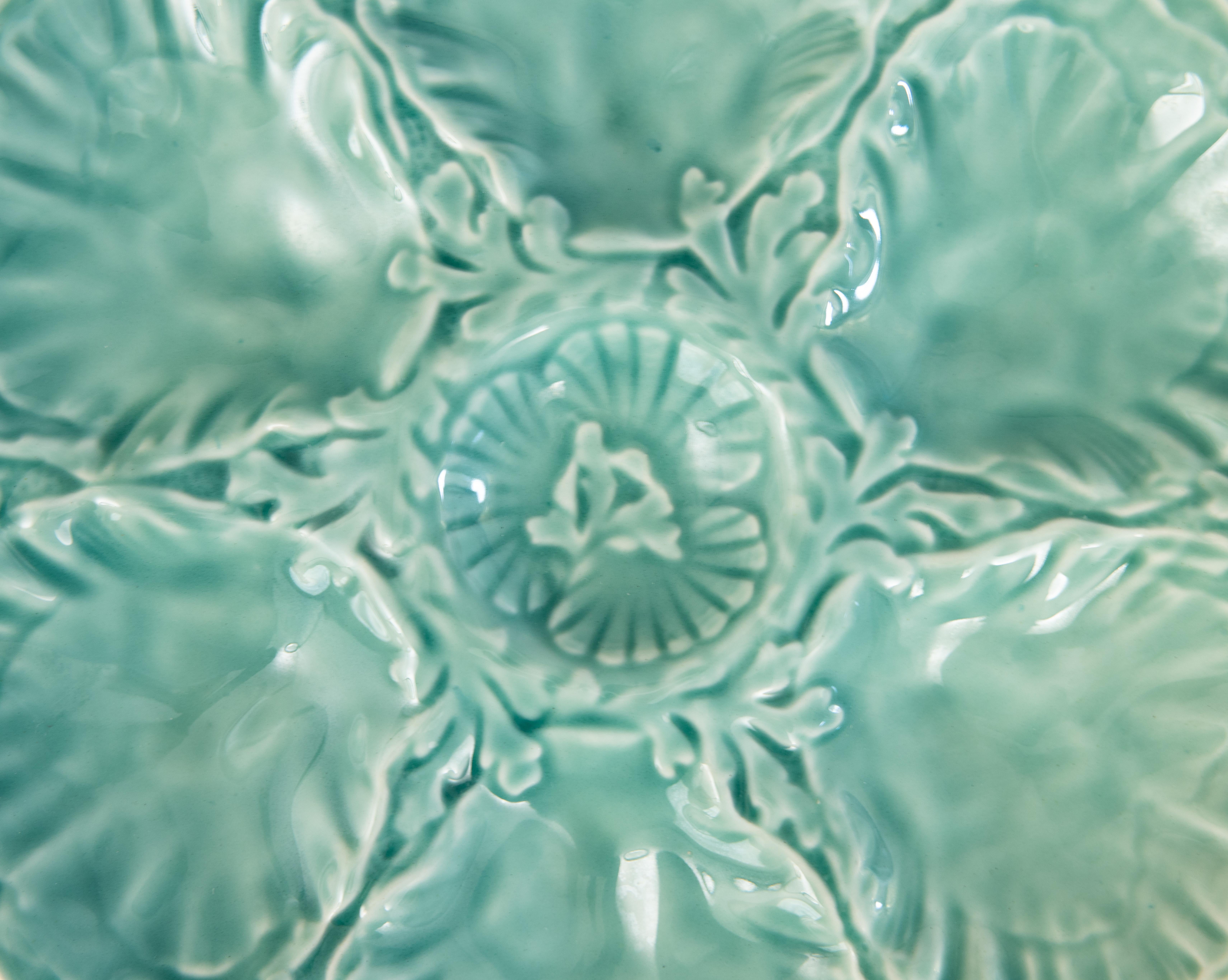 A gorgeous mid-century French Gien turquoise oyster plate, fluted at the edges, circa 1960. Maker's mark on reverse. It displays beautifully and would also be perfect for serving.