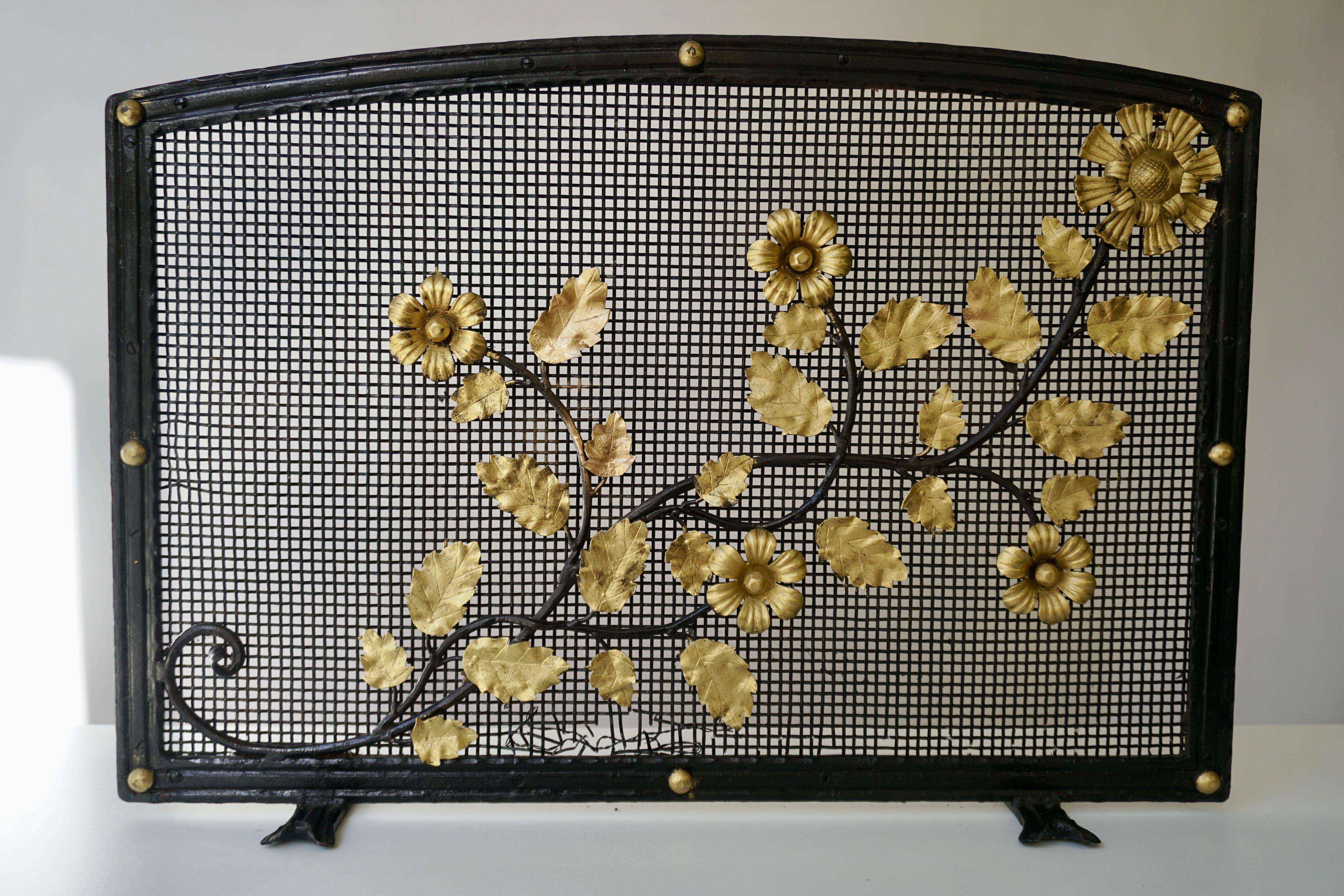 Fire screen with scattered golden flowers mounted on black metal rods. Mesh backing makes these an excellent choice for wood-burning fireplaces. 
Custom inquiries welcome.

Weight 7kg.