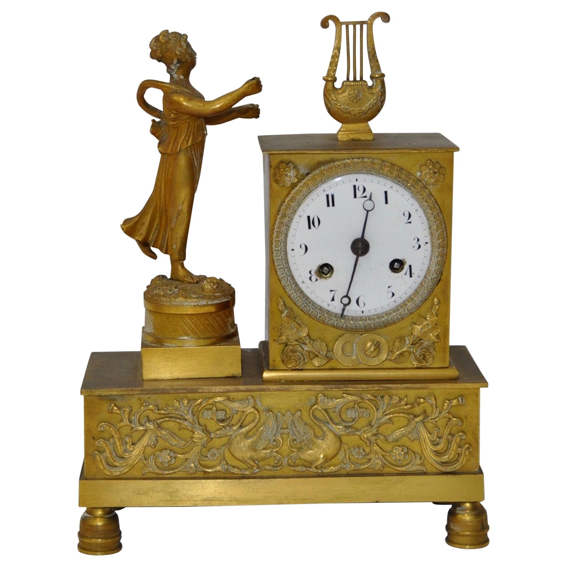 French Gilded Bronze Mantle Clock with Standing Figure, circa 1840s