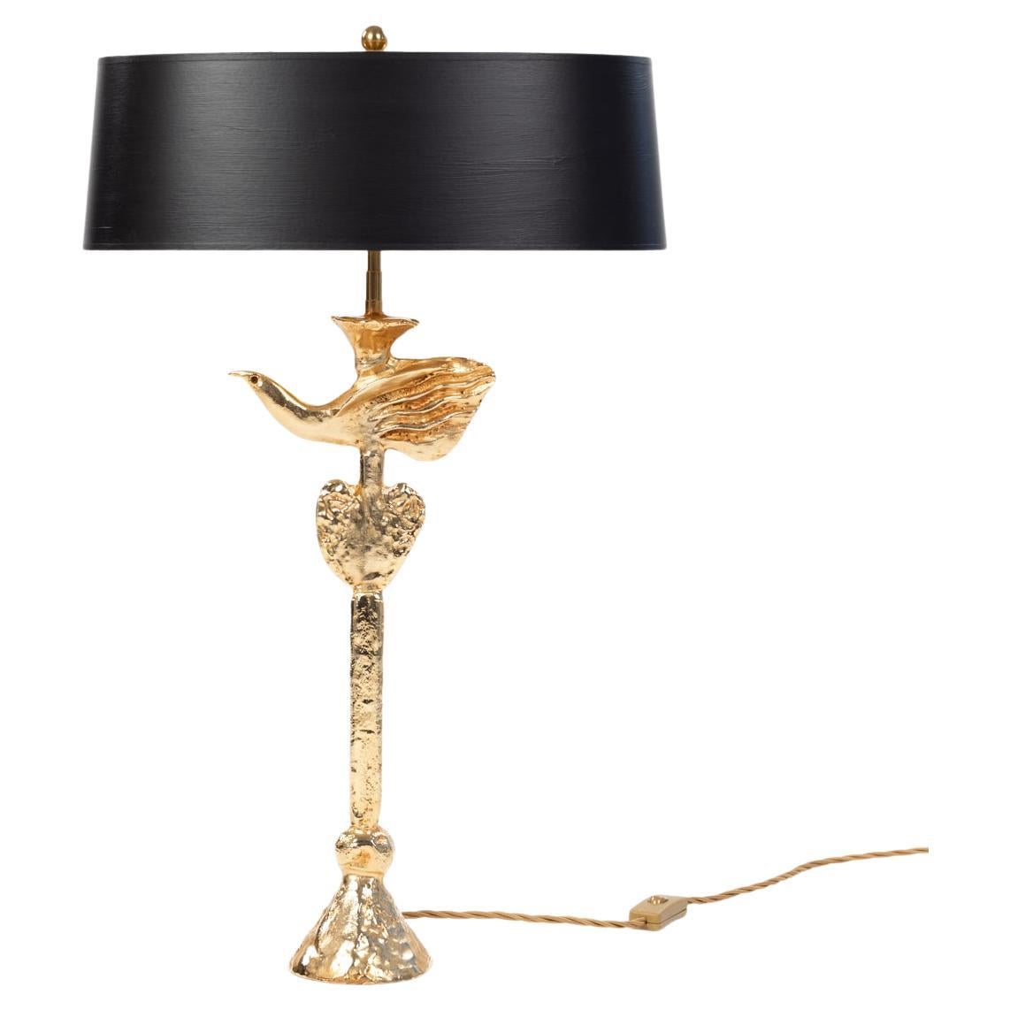 A fantastic 1980's sculptural gilt table lamp by Pierre Casenove for Fondica, signed.
Heavy, cast bronze object, fire-gilded. 
The electrics have been completely reworked, 2 transversely seated sockets with a little distance to the object ensure