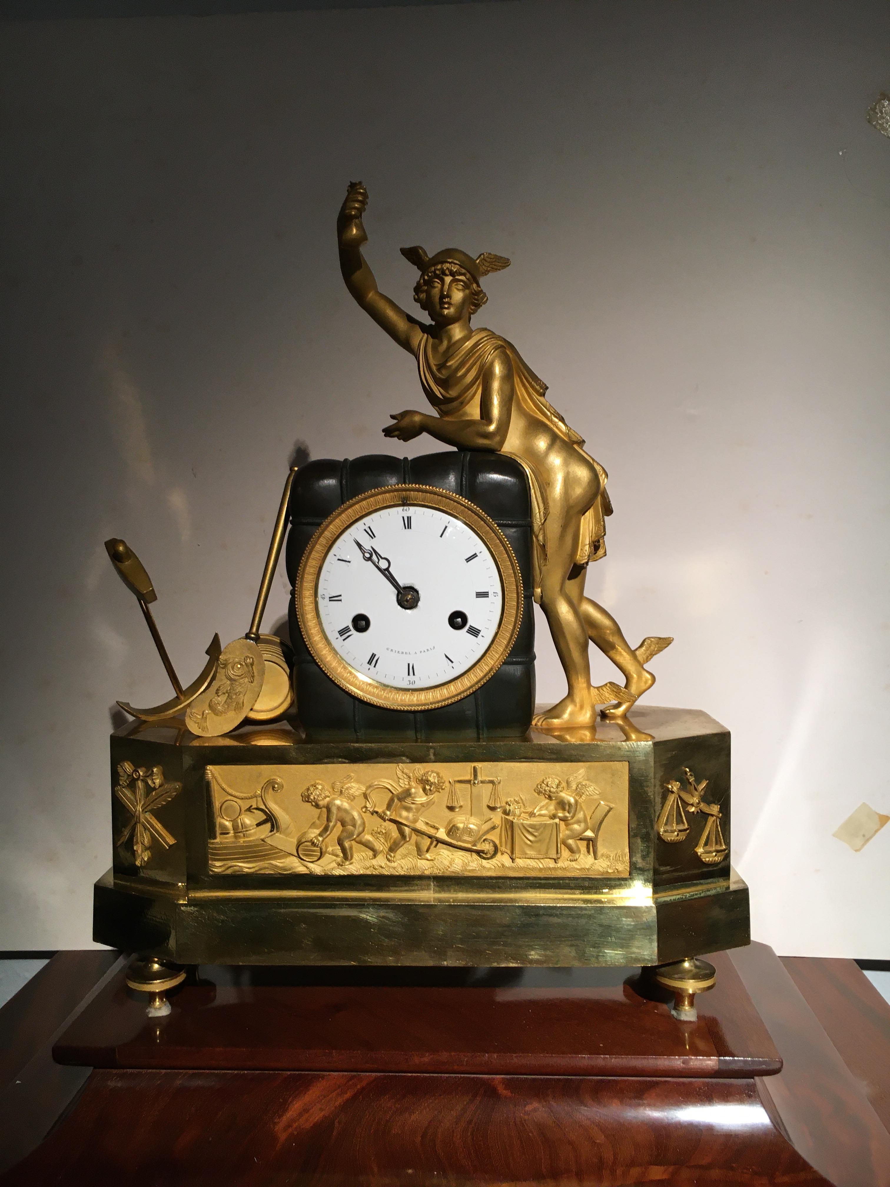 
French mantel clock  representing with the figure of Hermes and other trade symbols, in bronze with its original gilt  and green patina.
Signed at dial 