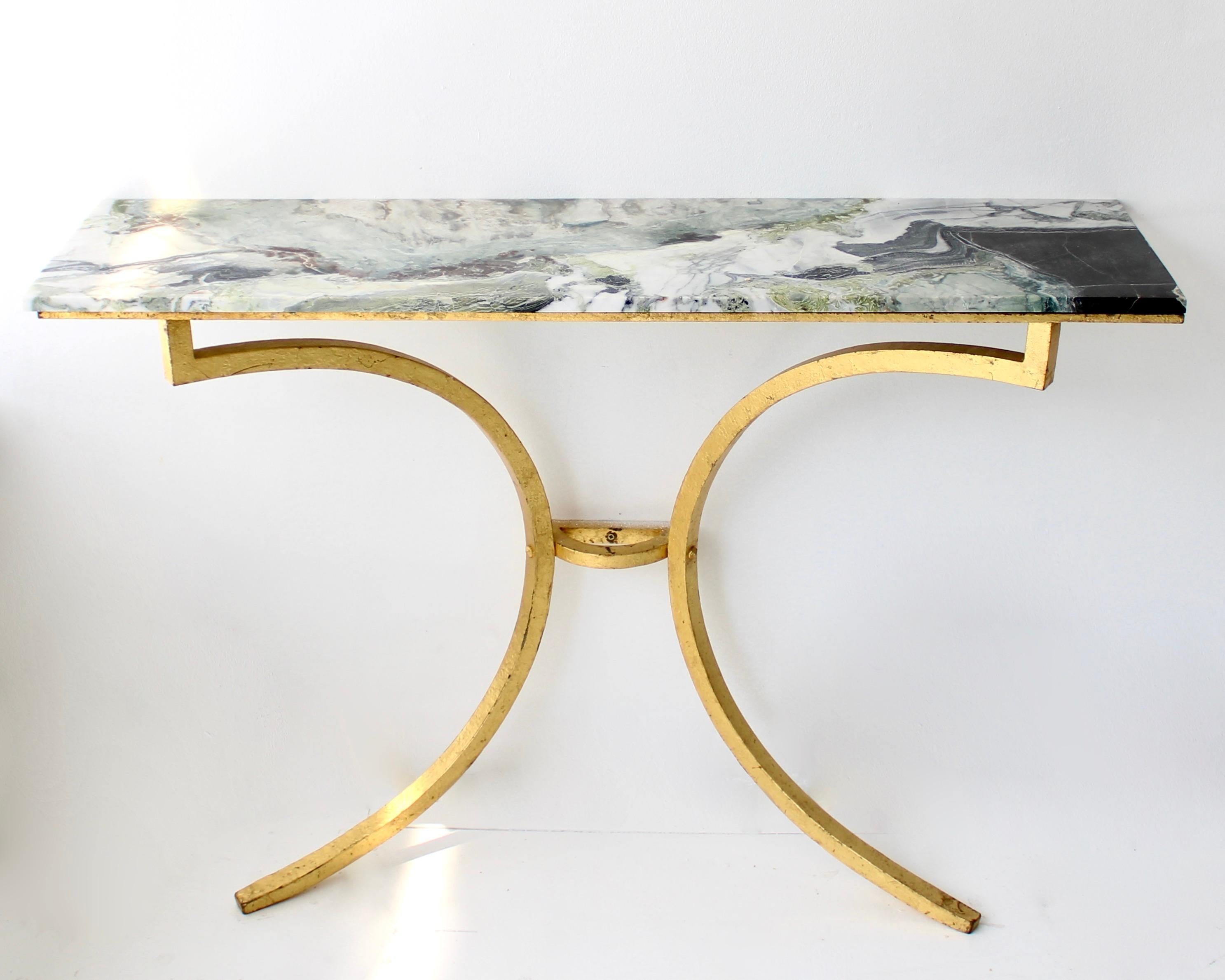 Rare French gilded iron console by Roger and Robert Thibier, circa 1960s. 
Wrought iron has been gilded with gold leaf for a gentle warm golden patina throughout the entire structure, including all the screws. French neoclassical /Mid-Century