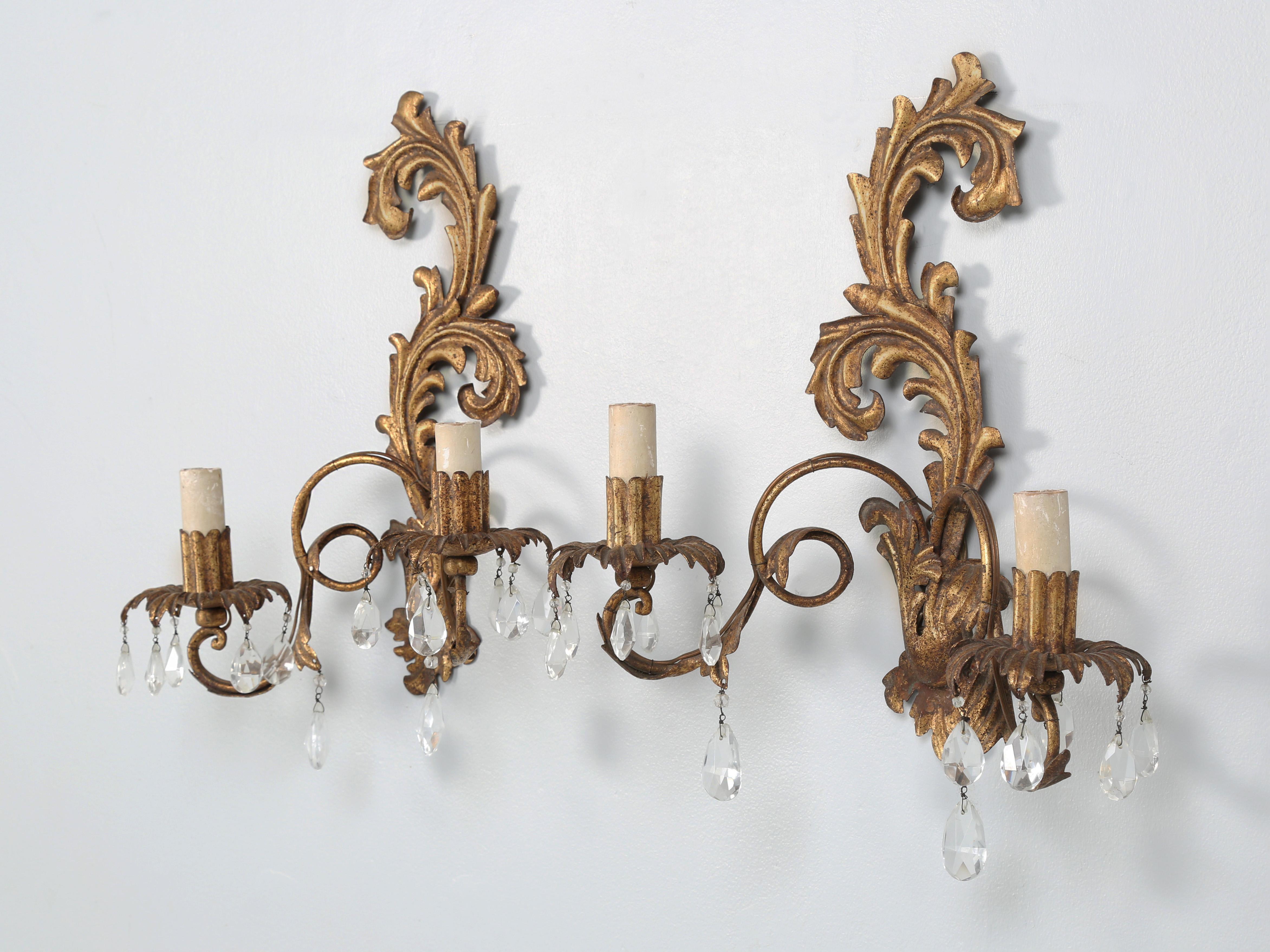Pair of Vintage French Wall Sconces in their Original Gilded Finish. The pair of Vintage Sconces look to have been made post War and are in nice original condition with a wonderful patina.