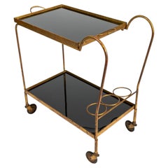 French gilded metal serving trolley, style Jean Royère, Jacques Adnet